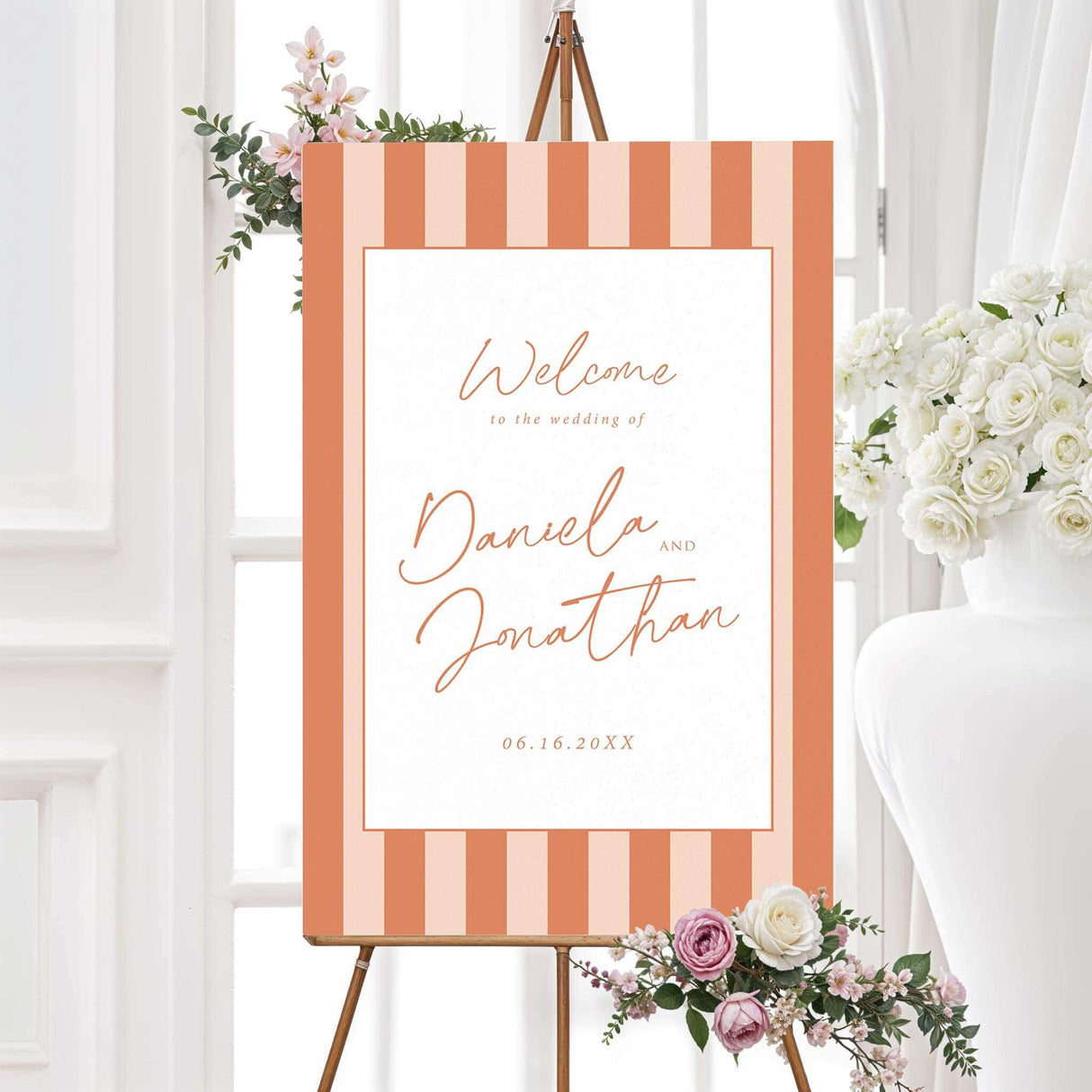 Wedding welcome sign with vertical terracotta and neutral stripes, white center panel, and handwritten script and serif fonts matching the Simply Written wedding suite.