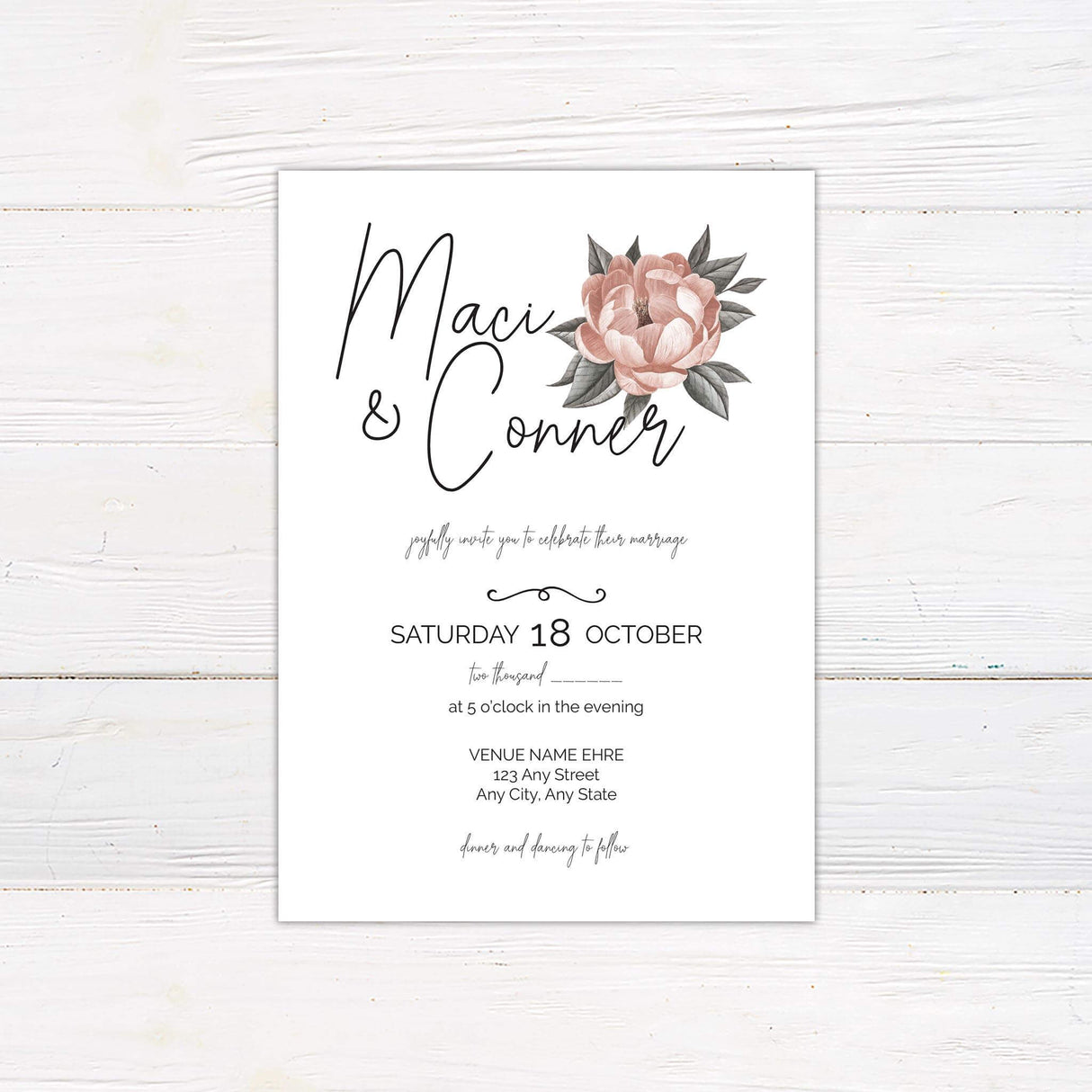 Minimalist wedding invitation with a single blush pink flower, handwritten script names, and classic serif body text on white background.