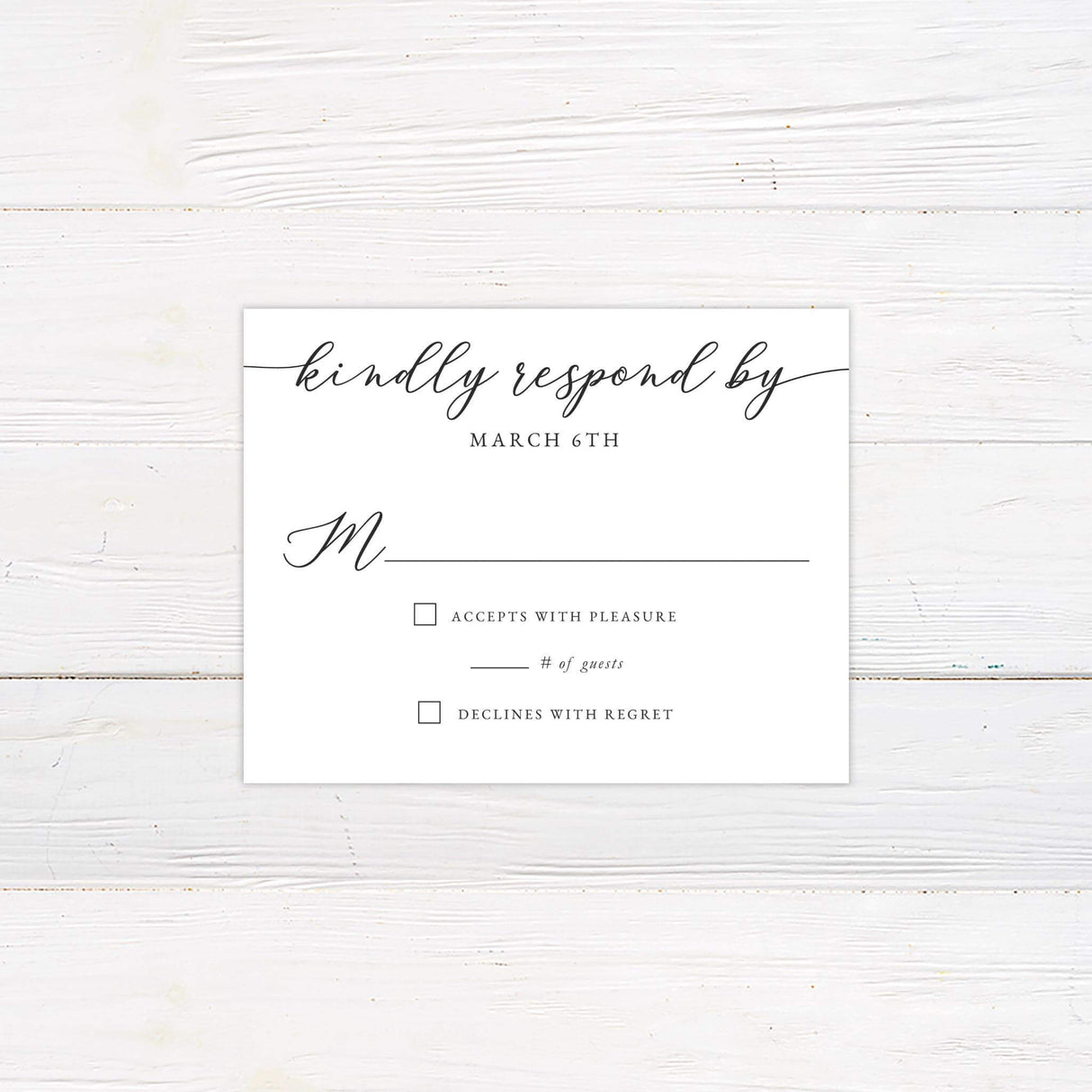 RSVP card with slanted handwritten script header and classic serif text, part of the Slanted Script wedding invitation suite.