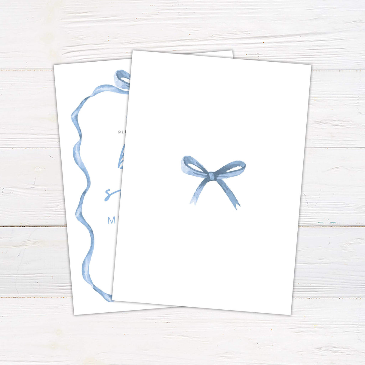 Baby shower invitation with a soft blue ribbon border and elegant script font. Features event details, RSVP information, and registry details. Perfect for celebrating an upcoming arrival. Back.