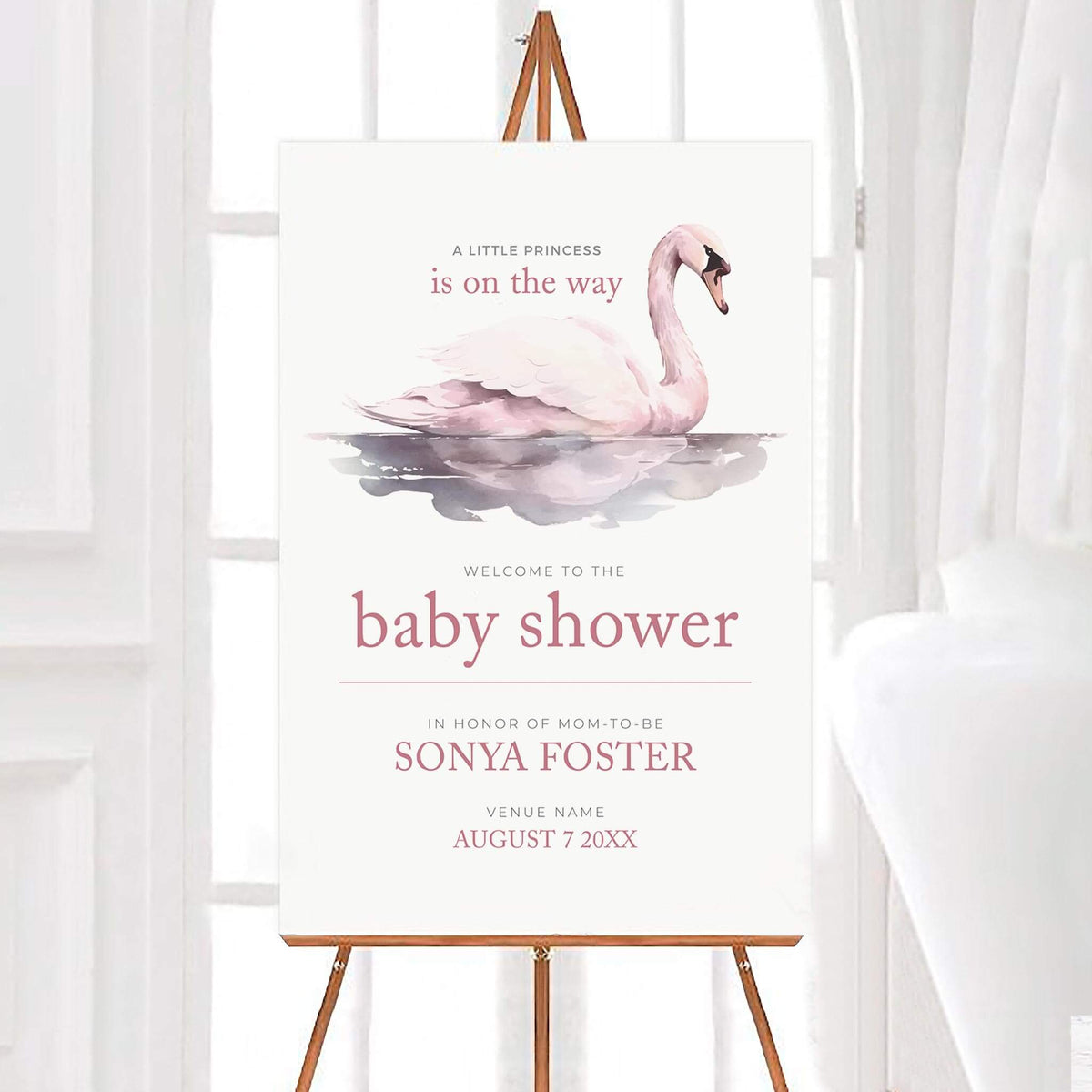 Personalized soft pink swan baby shower welcome sign featuring a soft pink watercolor swan floating on water with elegant pink lettering and a white background. The design includes a princess themed message and customizable name, venue, and event date.