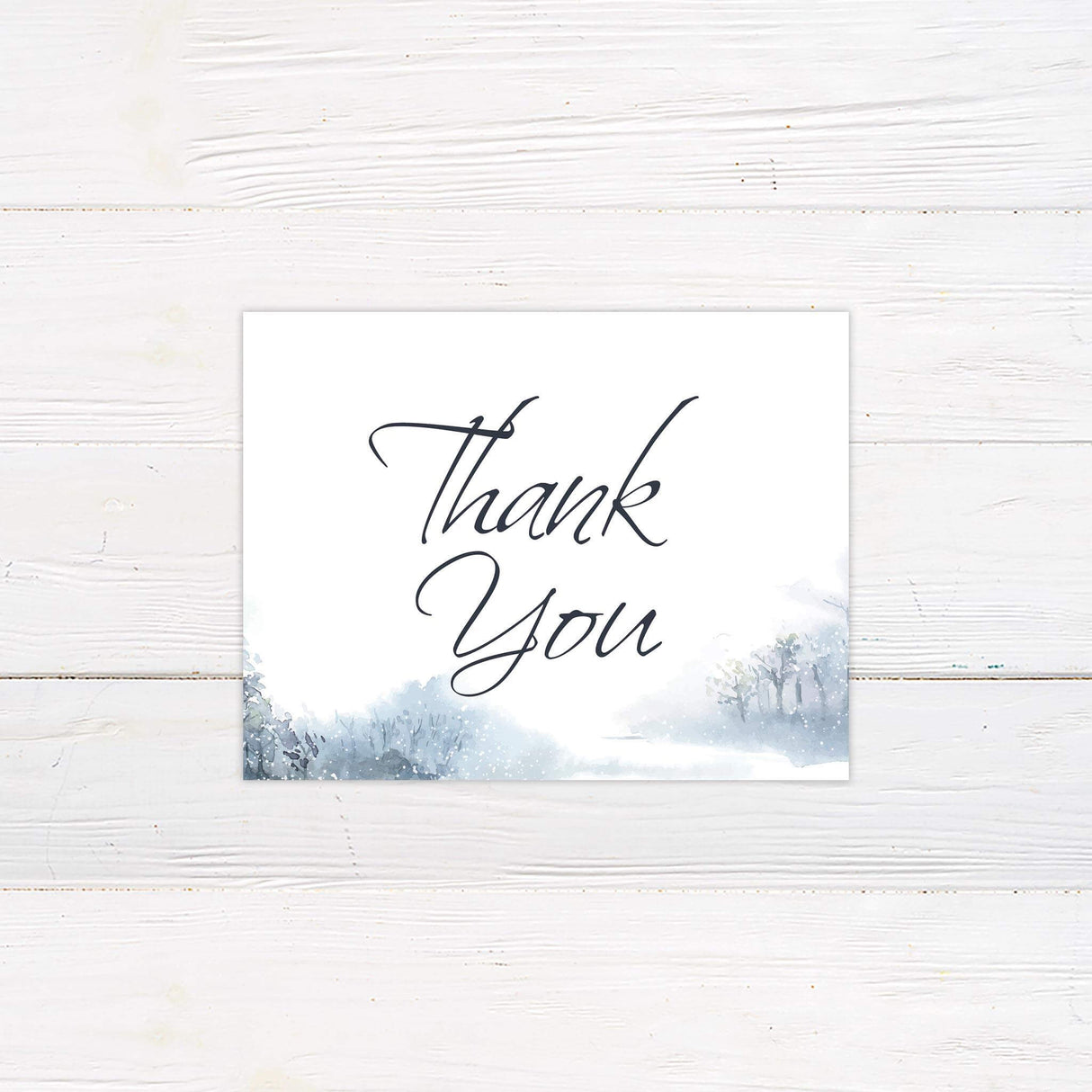 Thank you card featuring snowy watercolor accents and refined typography, matching the Soft Snowfall wedding collection.