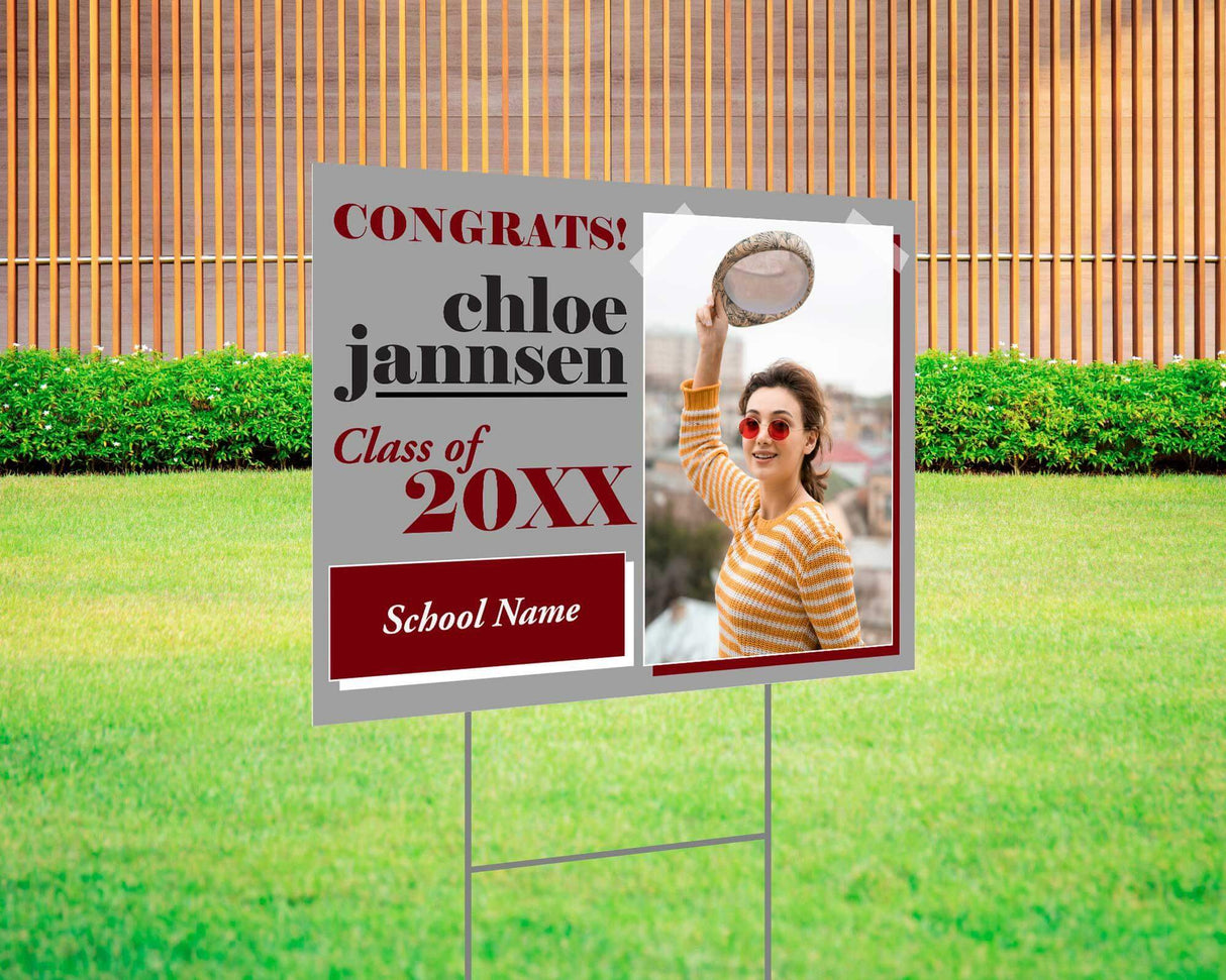 Fun and bold graduation yard sign with a split design featuring a photo on one side and playful, high-contrast text on the other. Includes "Congrats!" message, custom class year, and school name. Printed on durable Coreplast plastic, perfect for outdoor celebrations, driveways, and front yards. gray and red