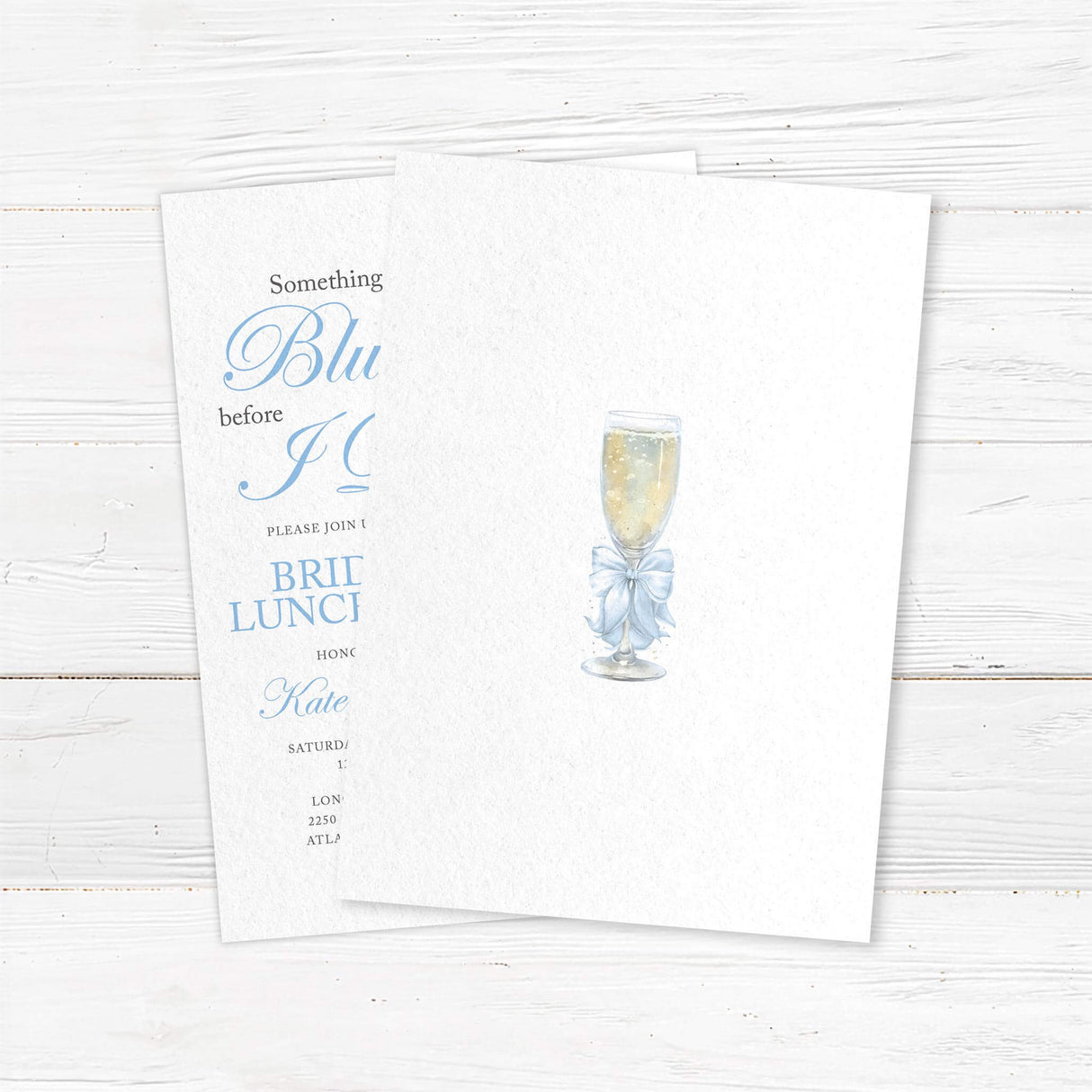 Watercolor bridal luncheon invitation with a champagne glass, light blue satin bow, and elegant script font for a pre-wedding celebration - back