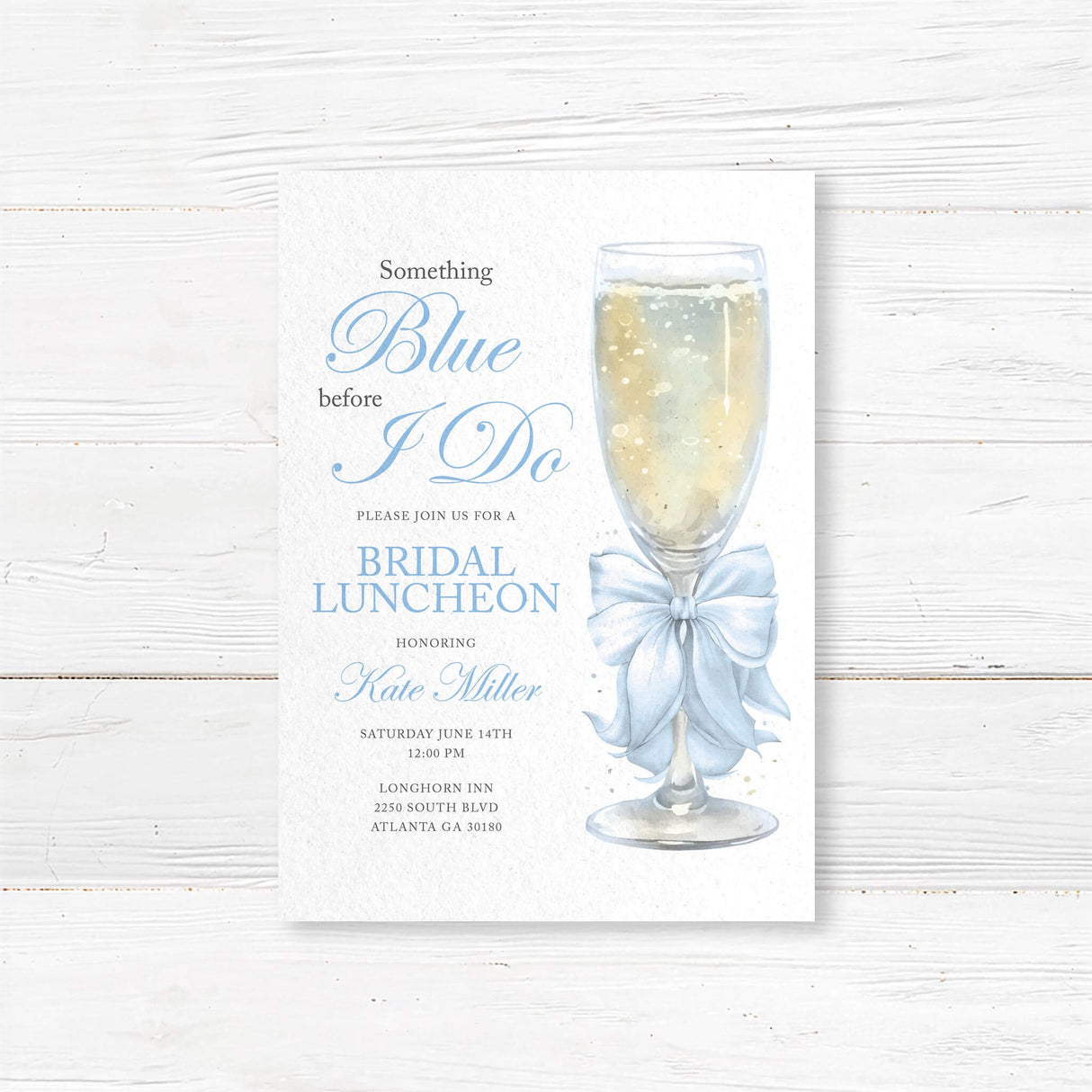 Watercolor bridal luncheon invitation with a champagne glass, light blue satin bow, and elegant script font for a pre-wedding celebration
