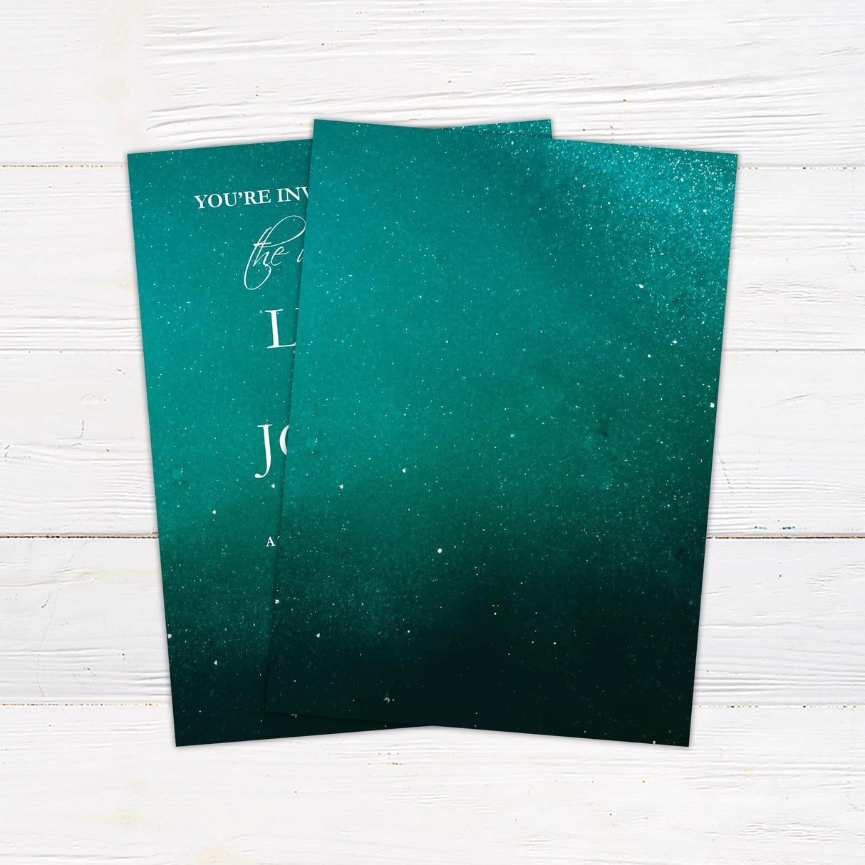 Elegant wedding invitation with a sparkling emerald green background and classic white serif and script fonts.- back side