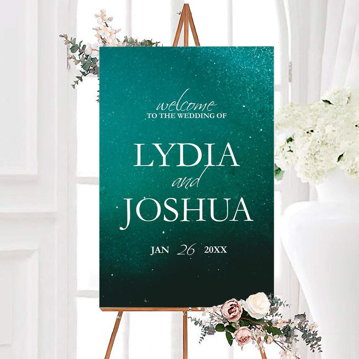 Sparkling emerald wedding welcome sign with a sparkling teal watercolor background and elegant white typography. The personalized design features the couple’s names and wedding date.
