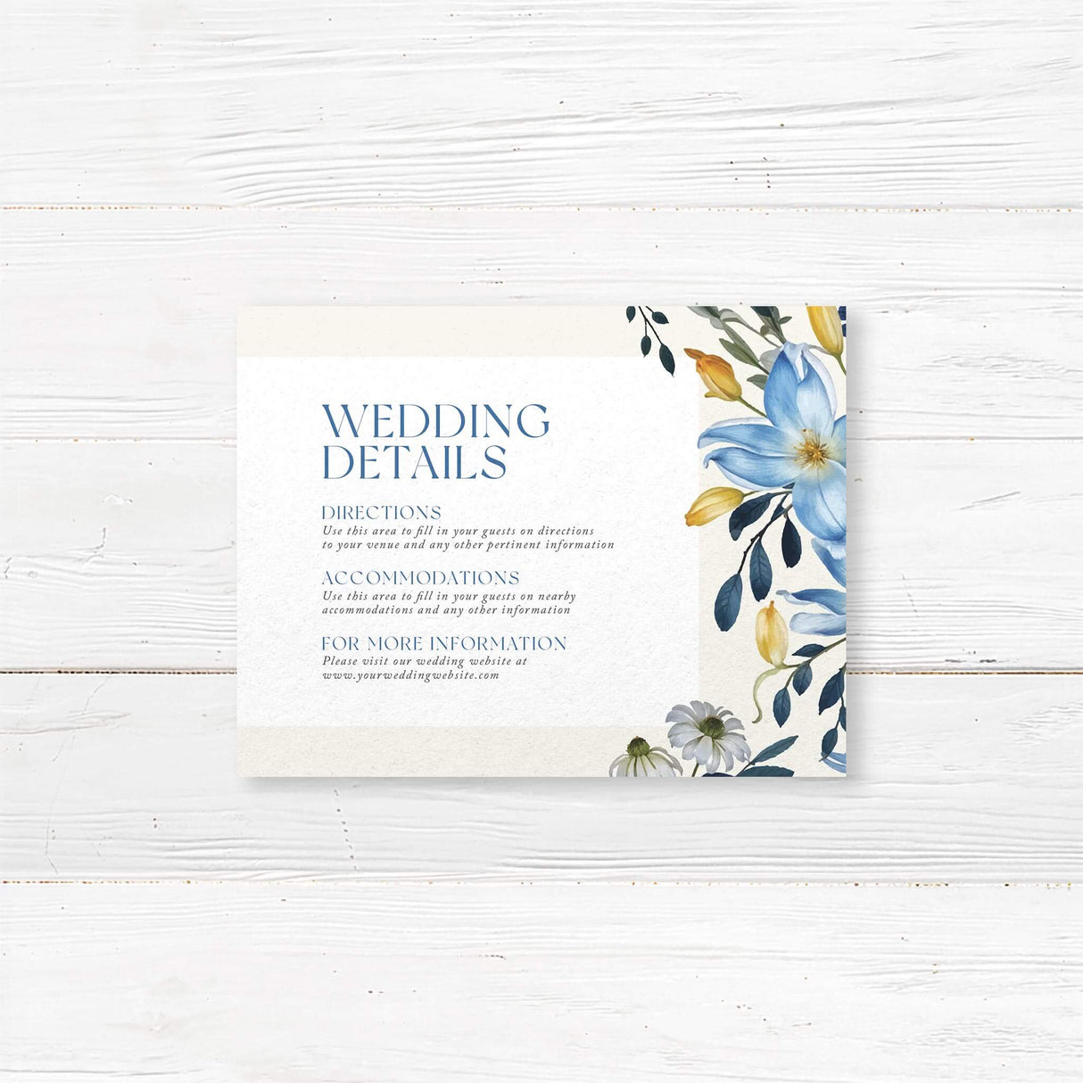 A details card with a soft cream background features an elegant floral border of blue, white, and yellow flowers with lush greenery. The text is centered within a white rectangle, using a mix of serif and script fonts for a sophisticated and timeless look. Event details, including the date, time, and venue, are clearly displayed. The design combines classic elegance with a modern floral touch, making it perfect for a romantic wedding celebration.