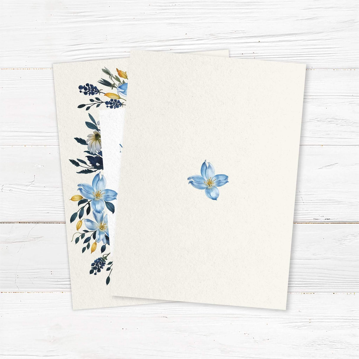 Elegant blue floral wedding invitation featuring hand-painted watercolor flowers and gold accents. Printed on premium cardstock, this custom wedding invite is perfect for rustic, boho, vintage, garden, or modern weddings. The sophisticated botanical design creates a timeless stationery look that sets the tone for your big day. Personalize with wedding details for a unique touch. back