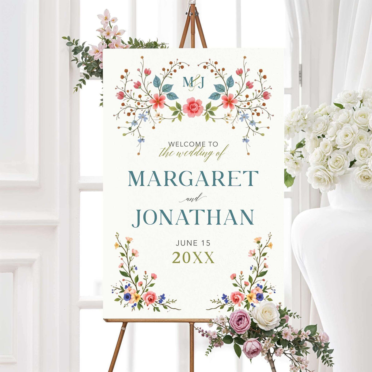 A sign with a background that features an elegant floral design with pink, blue, and yellow flowers, green leaves, and delicate branches adorning the top and bottom. The text is styled in a mix of serif and script fonts, creating a romantic and timeless feel. Event details, including the date, time, and venue, are clearly displayed in a well-balanced layout. This design exudes classic elegance, perfect for a garden, vintage, or floral-themed celebration.