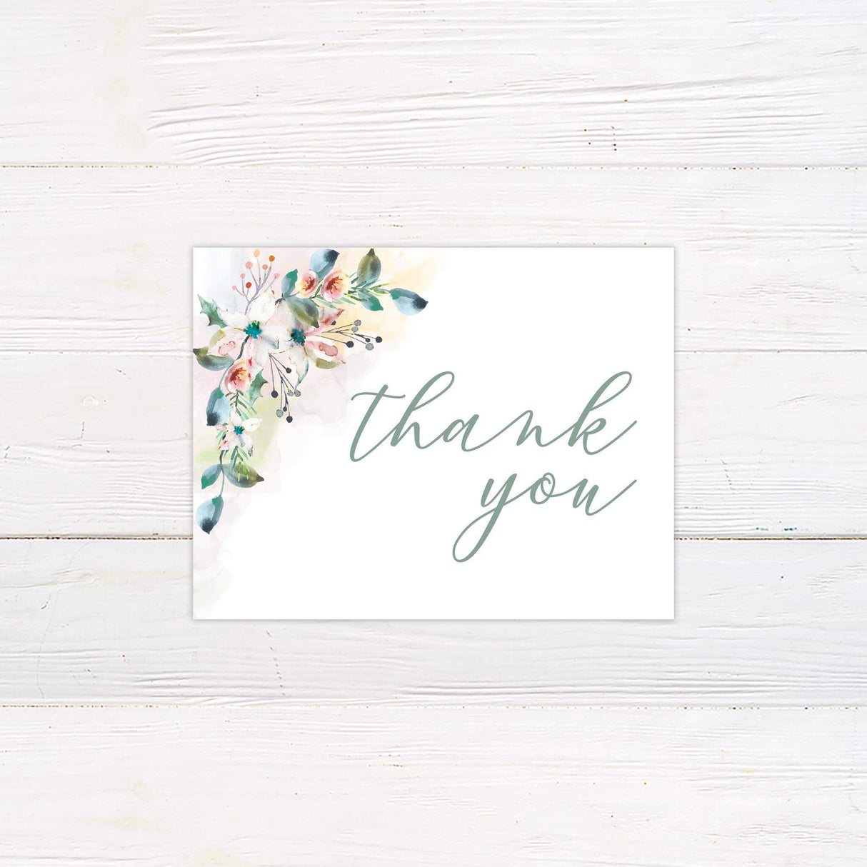 Printed thank you card with watercolor flower accents and delicate script to match the suite.