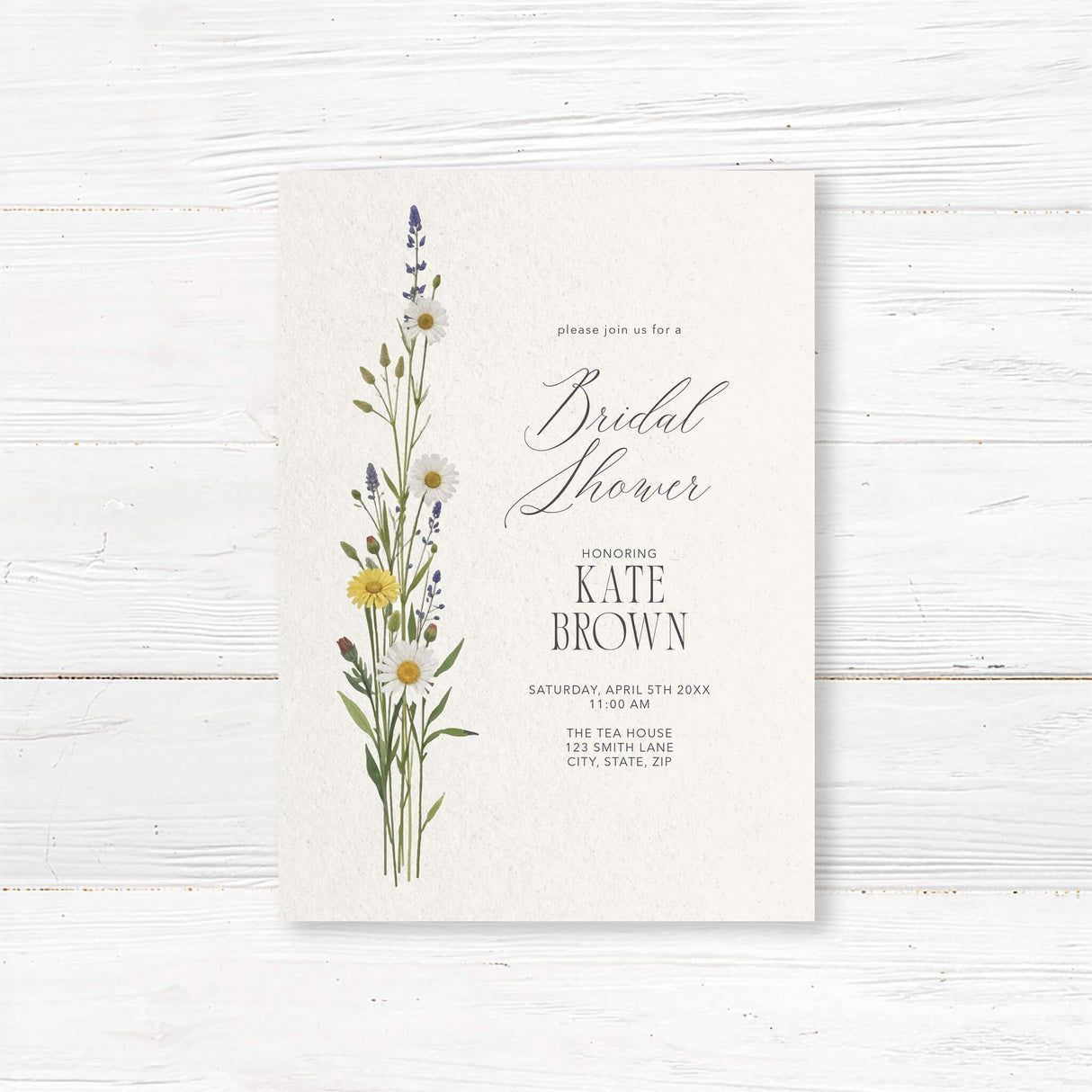 Minimalist bridal shower invitation featuring delicate wildflowers and elegant script typography. Customizable with the bride’s name and event details, perfect for rustic or garden-themed showers.