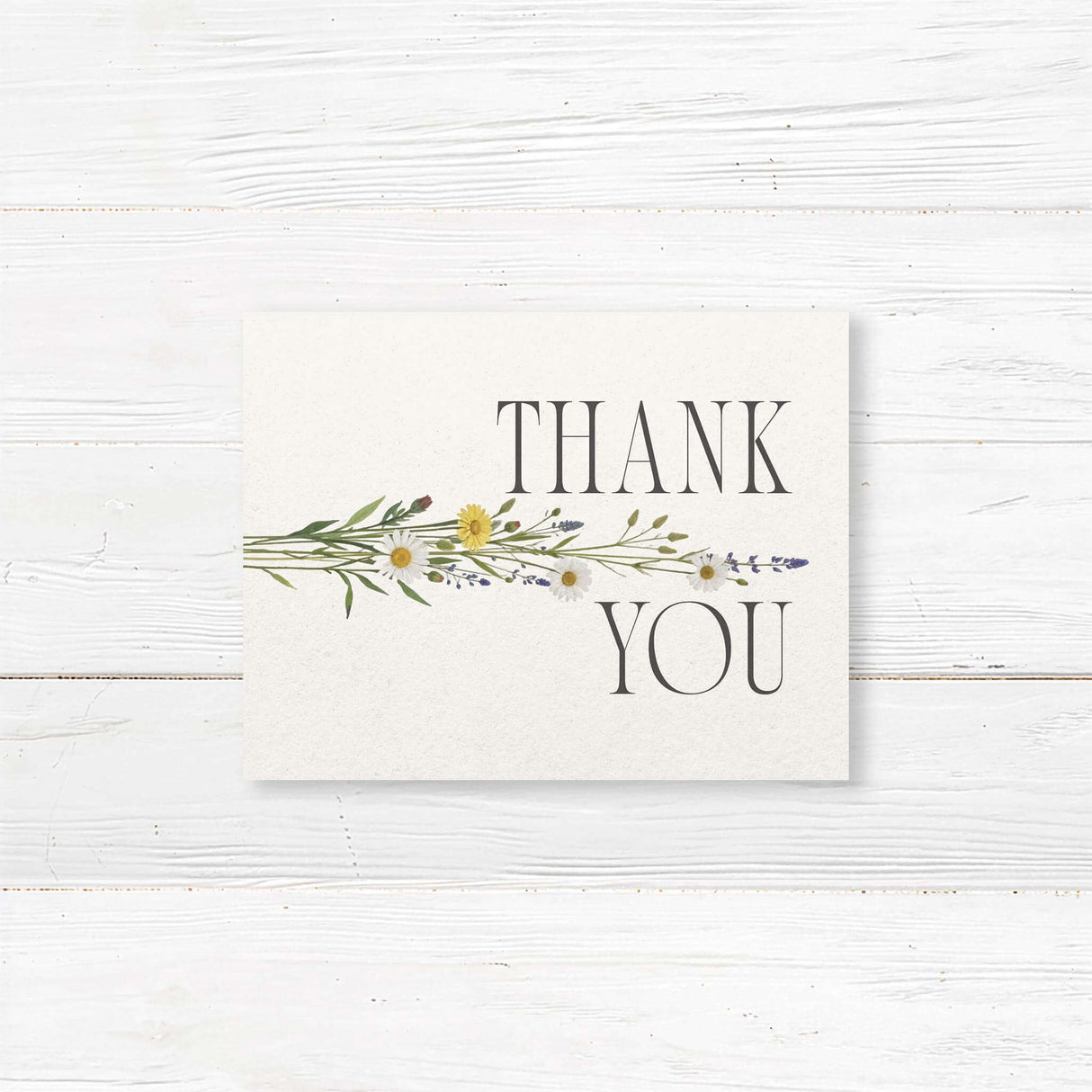 Charming thank you card with a delicate watercolor wildflower bouquet design, perfect for expressing gratitude with elegance and warmth. A timeless keepsake for wedding guests and loved ones.