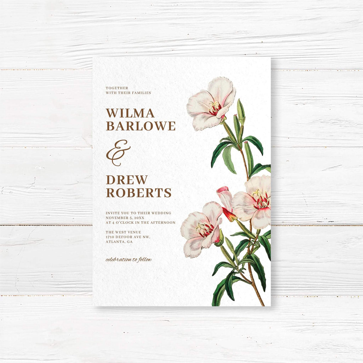 Wedding invitation with delicate watercolor flowers in soft blush and ivory tones, paired with classic serif fonts on textured white cardstock. Elegant spring botanical design from the Spring in Bloom stationery suite.