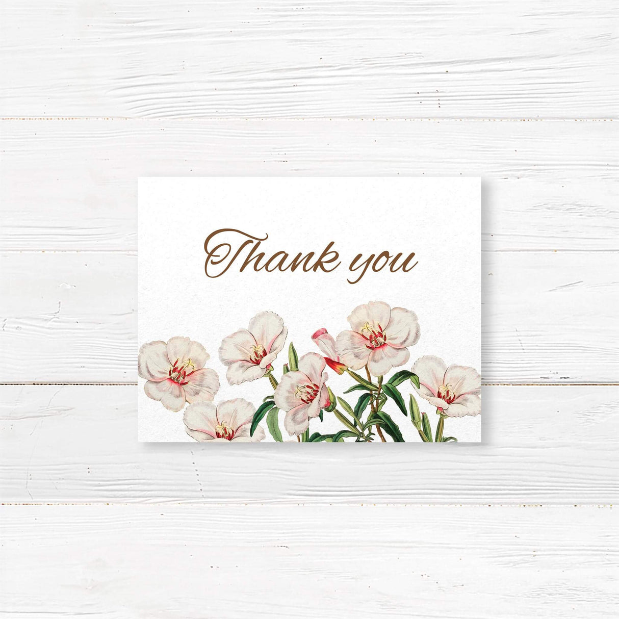 Thank you card with blush watercolor florals and serif fonts on white cardstock. Matches Spring in Bloom wedding suite. Blank or printed message options available.