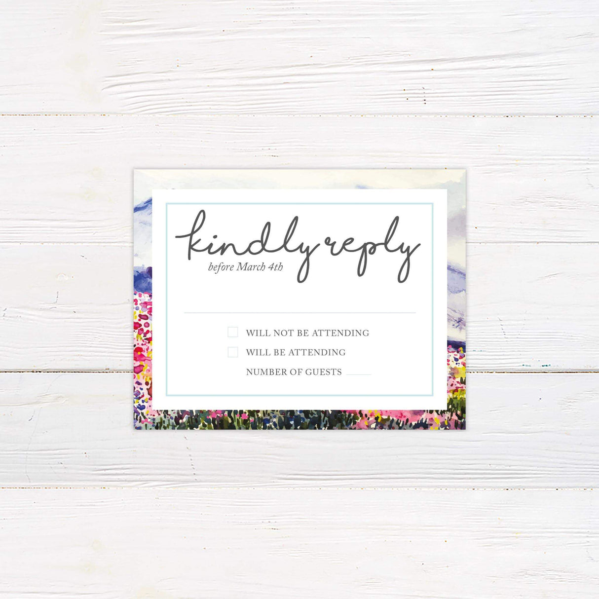RSVP card with coordinating watercolor florals and minimalist serif fonts.
