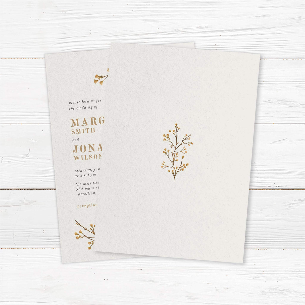 Minimalist botanical wedding invitation featuring delicate gold vine illustrations on textured ivory cardstock. Customizable with names, wedding date, and venue details. Perfect for rustic, boho, and nature-inspired weddings. Professionally printed on high-quality cardstock with matching envelopes included for a timeless wedding stationery suite. back