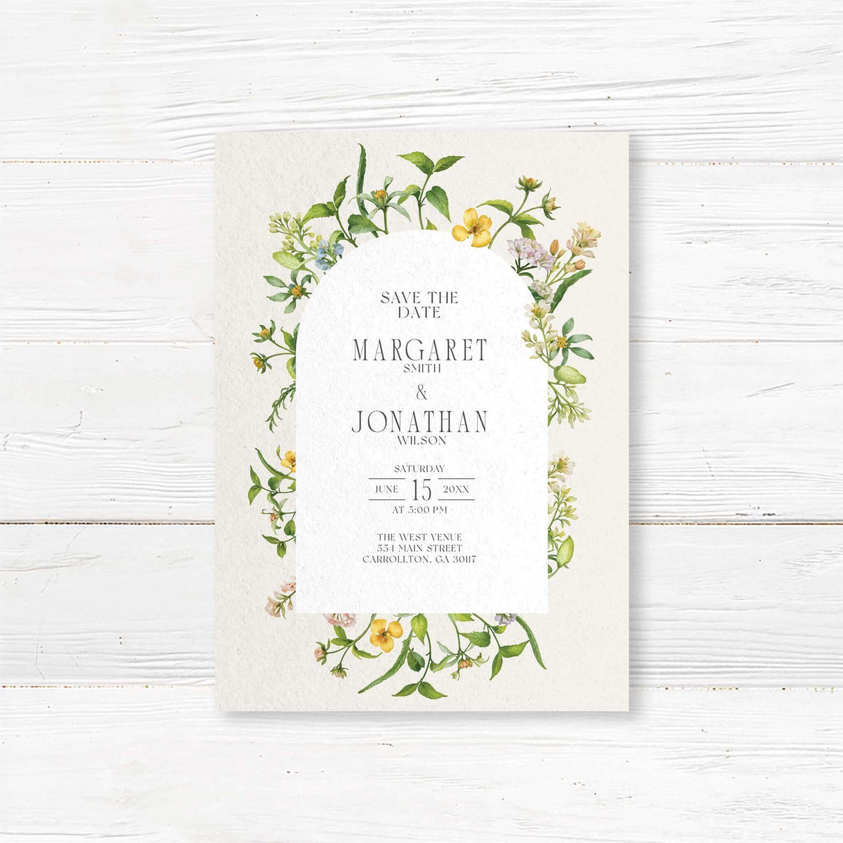 Elegant wedding invitation featuring a delicate watercolor floral arch with soft yellow, green, and pastel blooms. The modern arched text area creates a timeless and romantic aesthetic, perfect for nature-inspired weddings