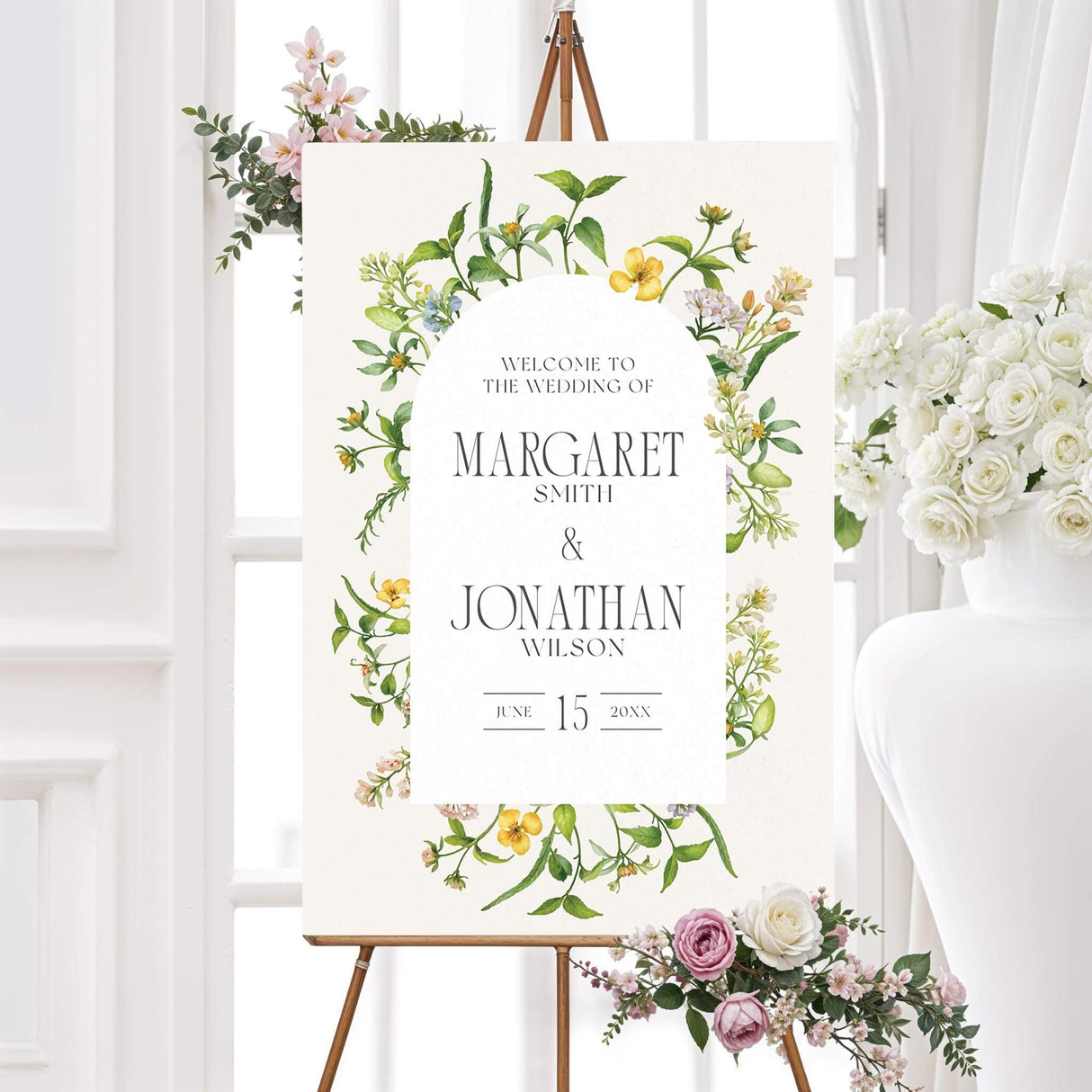 Elegant wedding welcome sign featuring a romantic watercolor floral arch with delicate yellow and green wildflowers. A warm and inviting design to greet guests at the ceremony or reception.