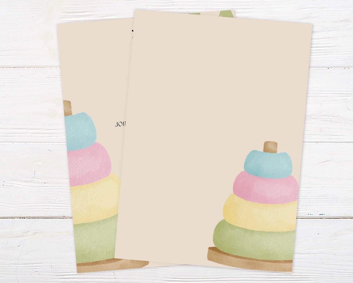 Neutral baby shower invitation with pastel stacking rings and elegant typography. Perfect for gender-neutral, minimalist, or modern baby shower celebrations. Back.