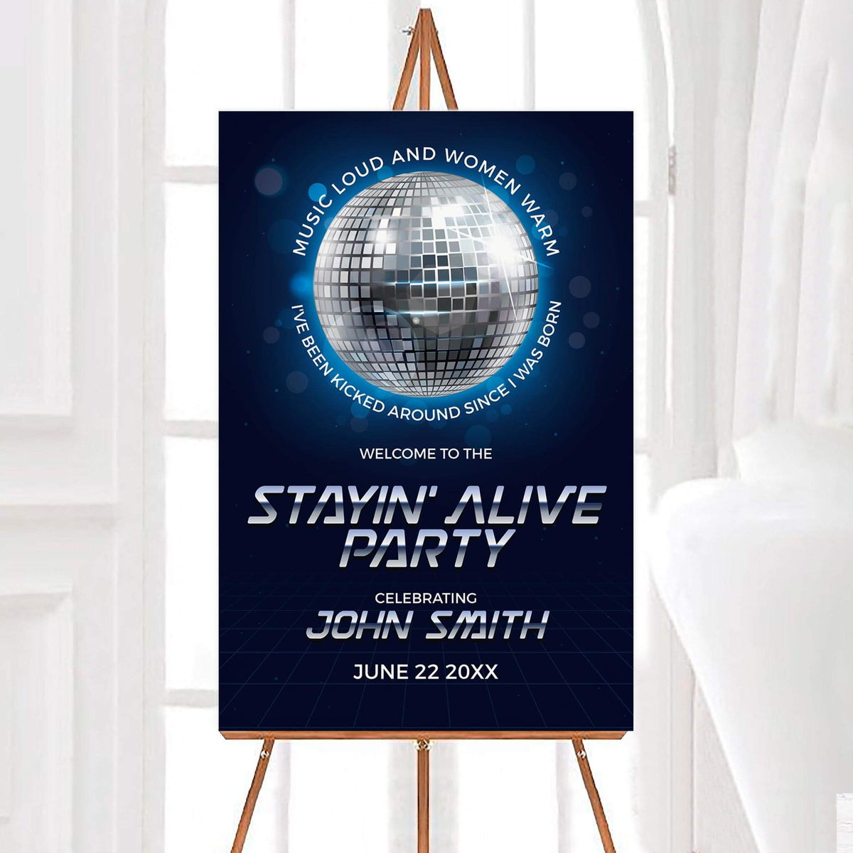 Retro stayin alive disco birthday party welcome sign featuring a large silver mirrored disco ball against a dark blue background with glowing lights. Bold metallic lettering displays the Stayin' Alive party theme with a personalized name and celebration date.