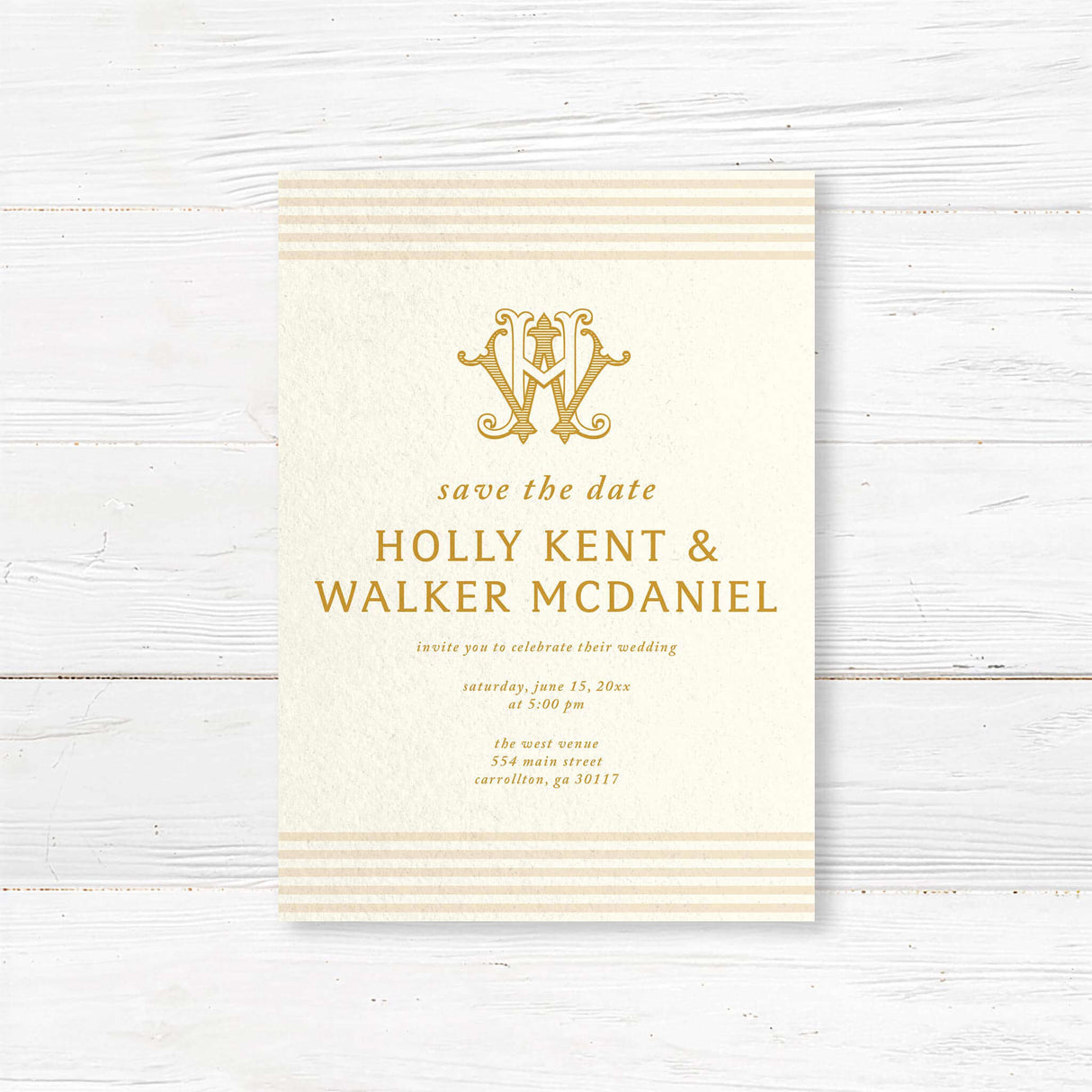 Save the Date card with gold serif text, cream background, neutral stripe accents, and decorative monogram—part of a coordinated gold wedding invitation suite.