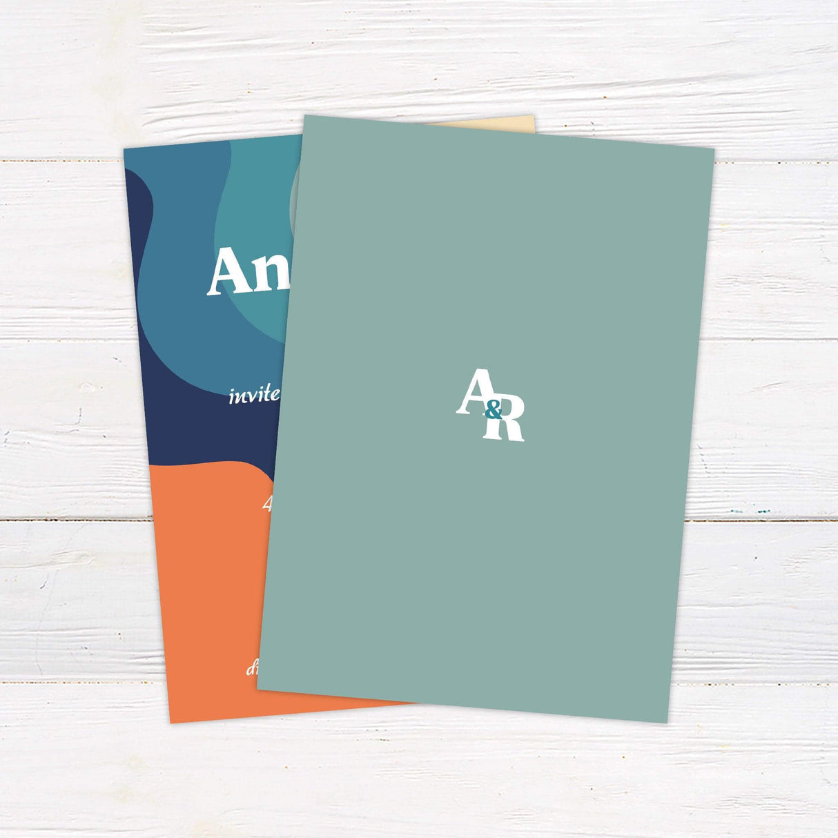 Colorful retro 70s wedding invitation with bold wavy stripes in orange, teal, and navy and groovy vintage fonts on cream background. - back side