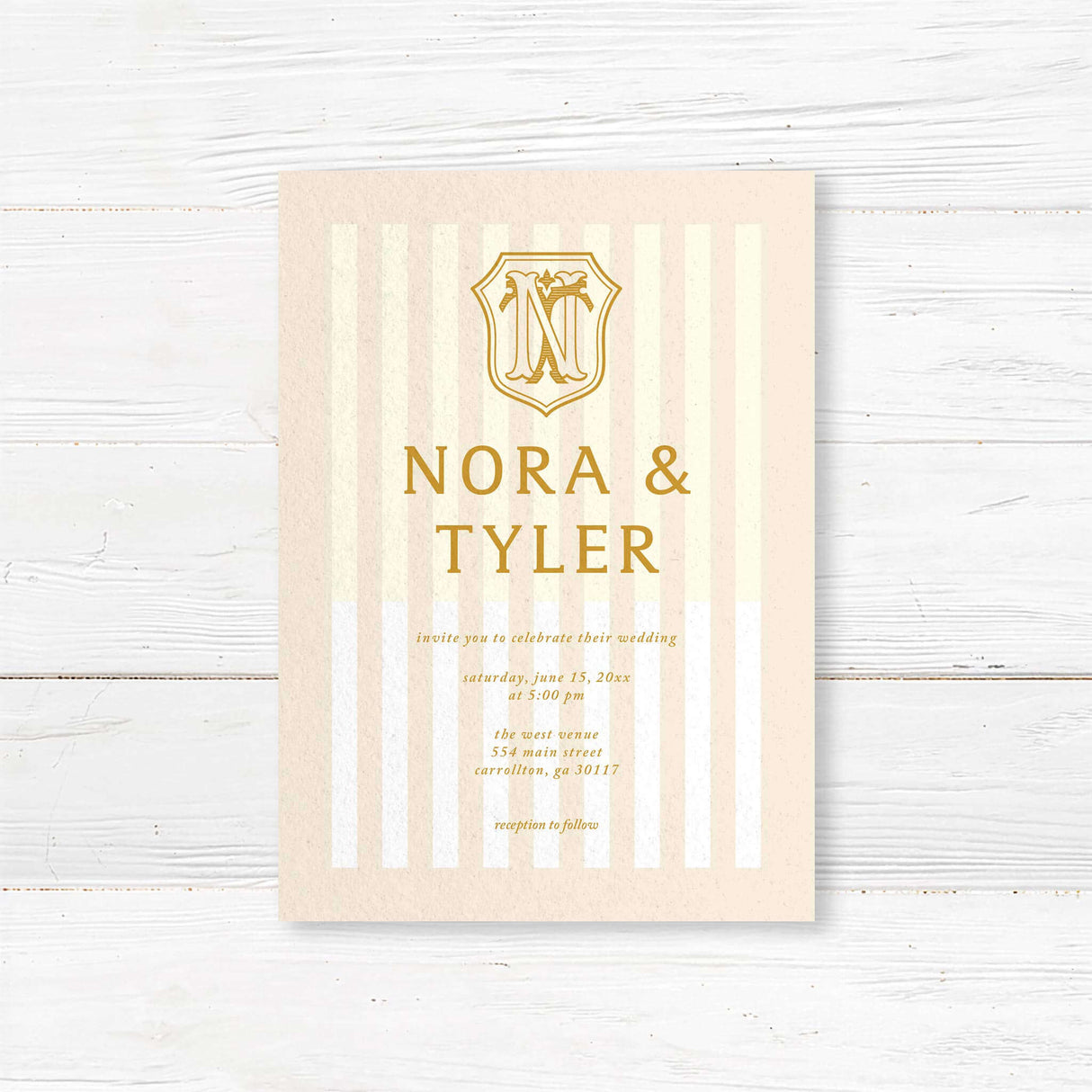 Cream and gold wedding invitation with vertical stripes and vintage-style crest monogram