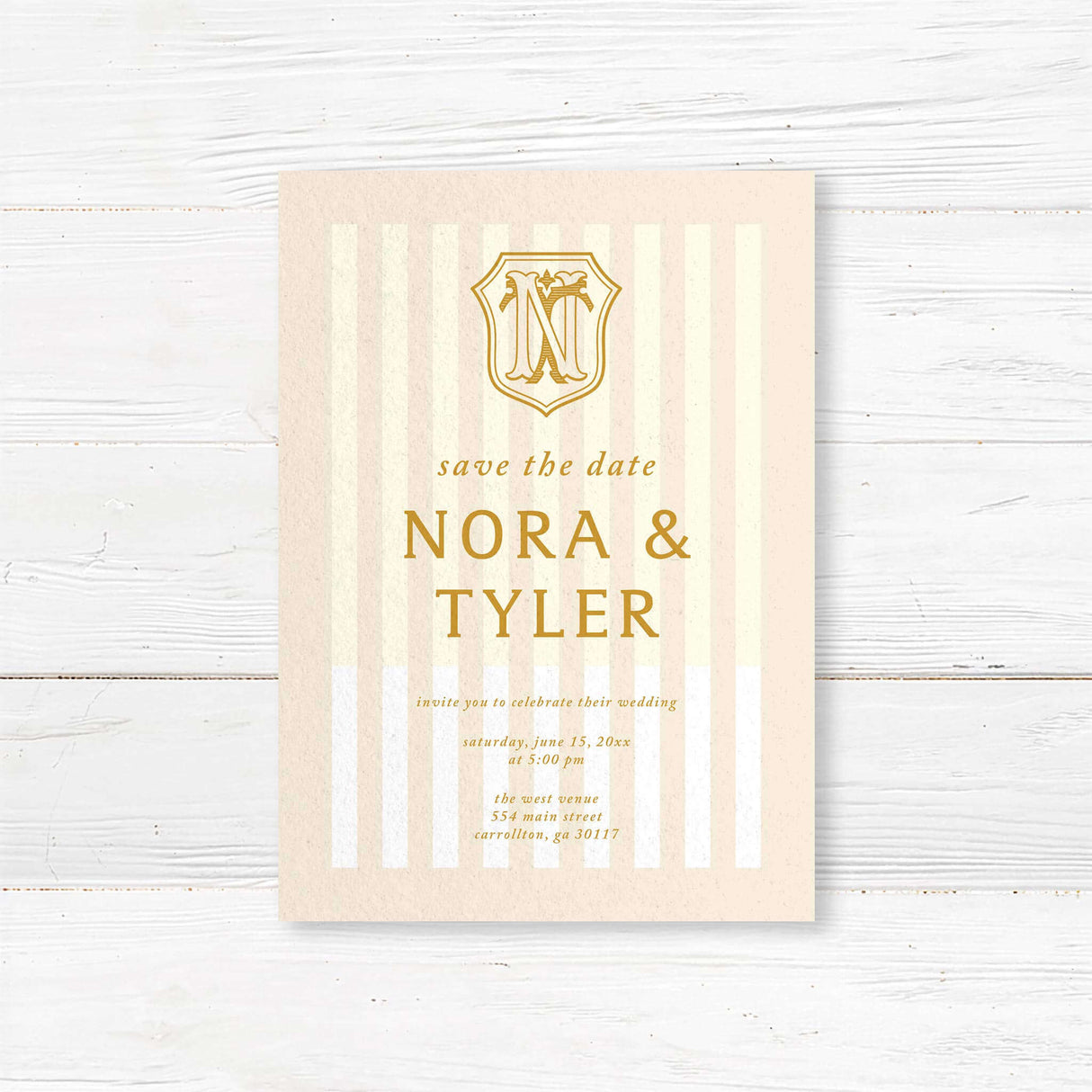 Save the Date card with cream vertical stripes, gold serif text, and vintage monogram
