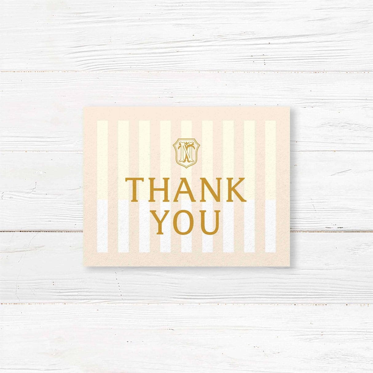 Cream and gold wedding thank you card with vertical stripes and elegant serif font