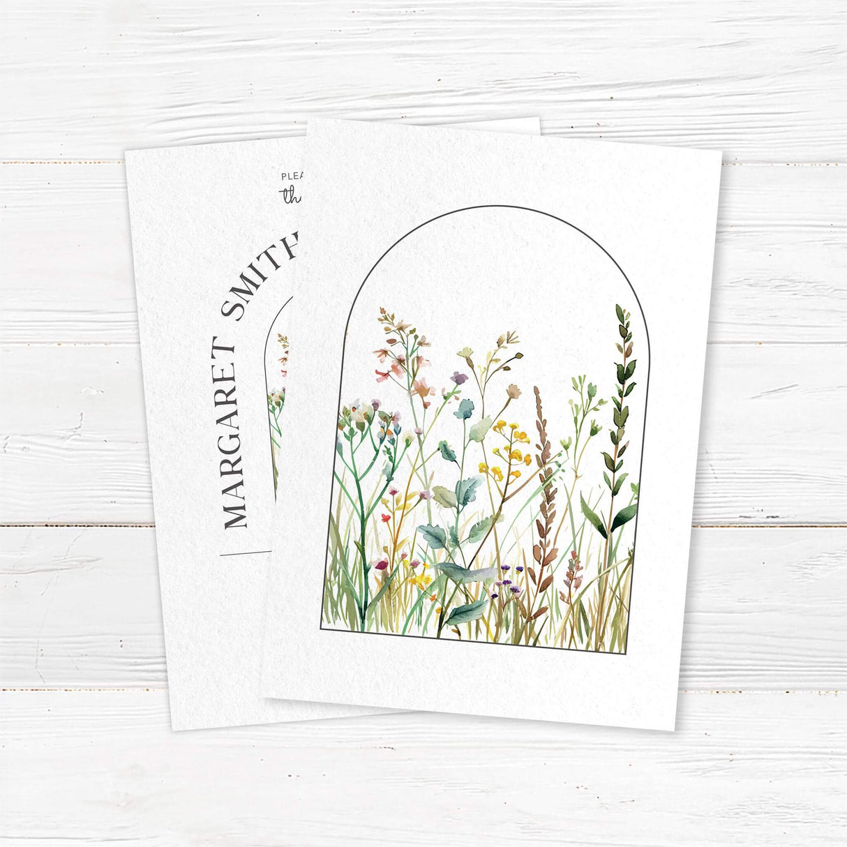 Elegant arch wedding invitation with delicate watercolor wildflowers on textured cardstock. Customizable with names, wedding date, and venue details. Perfect for rustic outdoor weddings, botanical ceremonies, and modern minimalist weddings. Printed on premium cardstock with matching envelopes for a timeless wedding stationery suite. back