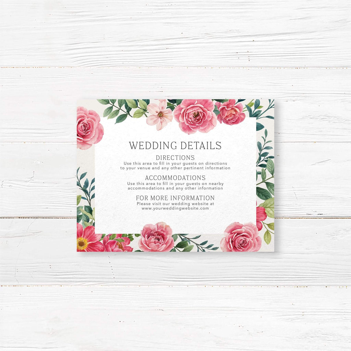 Elegant wedding details card with a floral design featuring pink and red roses, green leaves, and delicate typography. The text is framed within a white rectangle, providing event details in a classic serif font. A timeless design perfect for wedding celebrations.