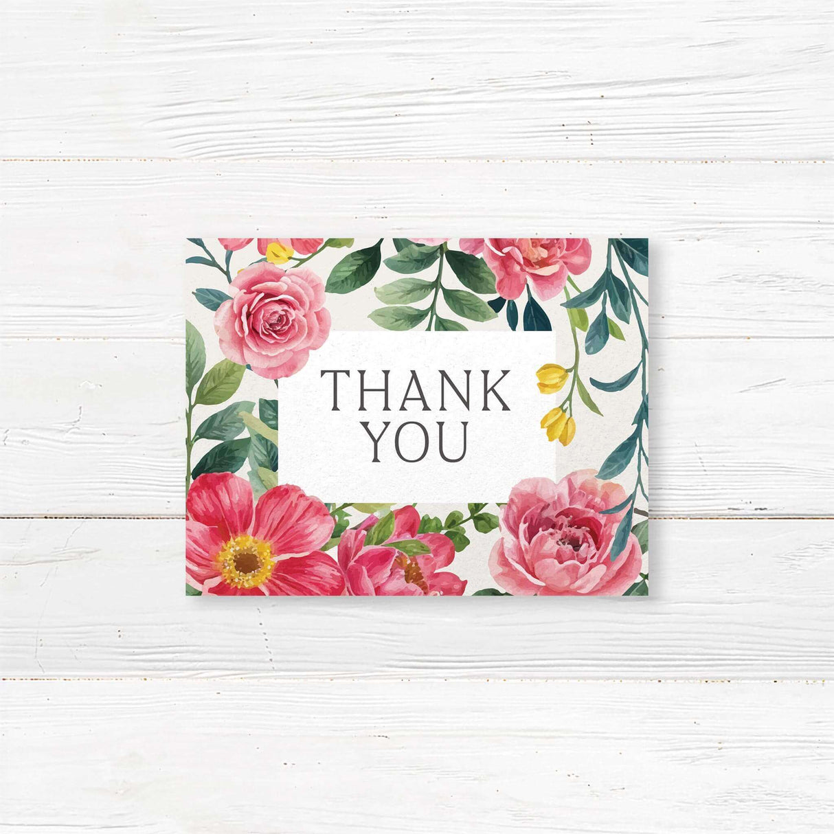 Elegant note card with a floral design featuring pink and red roses, green leaves, and delicate typography. The text is framed within a white rectangle.