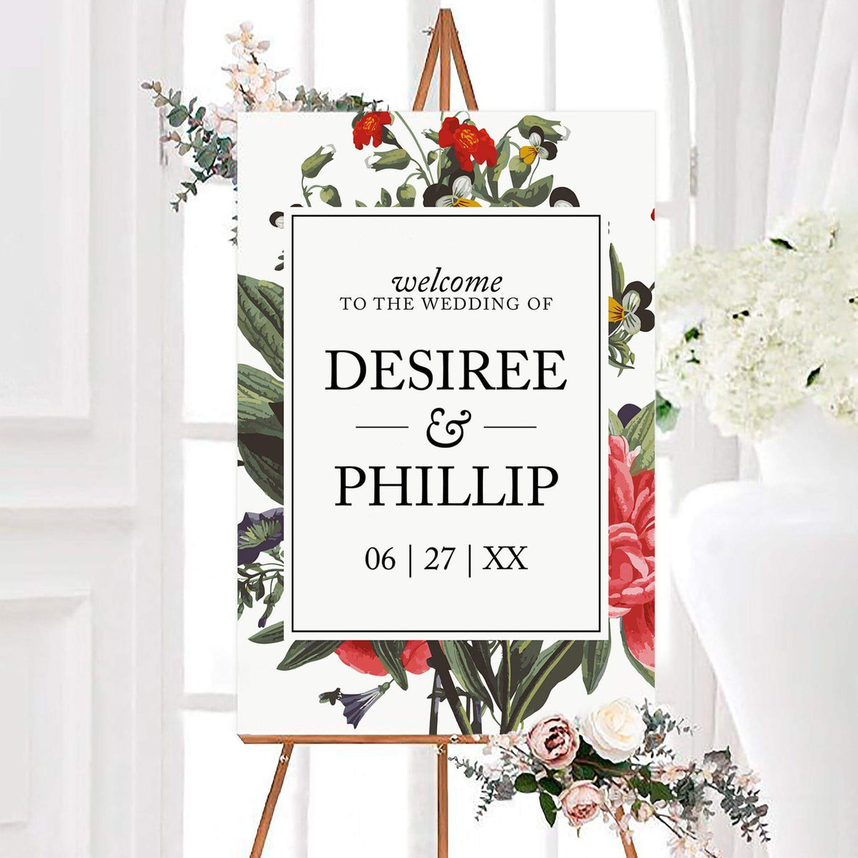 Colorful summer bouquet wedding welcome sign featuring red, coral, white, yellow, and purple flowers with lush green leaves. A white center panel displays the couple’s names and wedding date in elegant black typography.