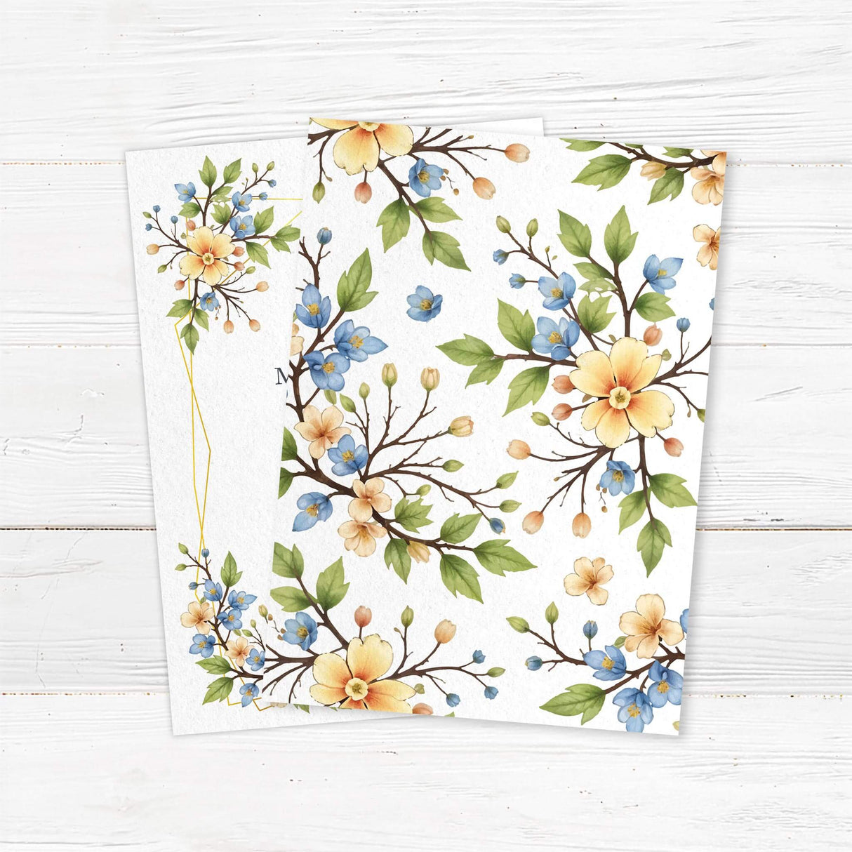 Elegant wedding invitation featuring a delicate watercolor floral border with yellow and blue flowers intertwined with greenery and a modern gold geometric frame. A timeless and sophisticated design perfect for garden, rustic, and classic weddings. Back.