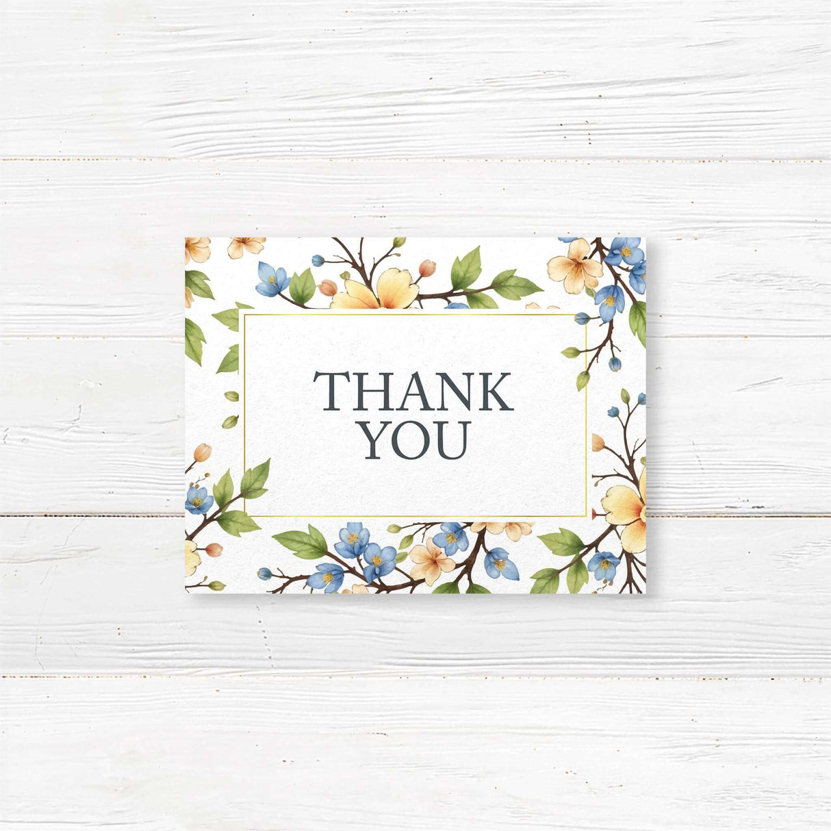 Charming thank you card with a delicate watercolor floral border of blue and yellow flowers, perfect for expressing gratitude with elegance and warmth. A timeless keepsake for wedding guests and loved ones.