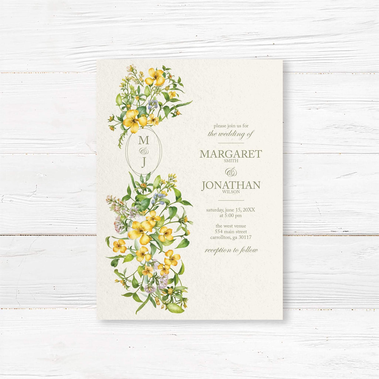 Elegant wedding invitation with a floral design featuring yellow and white flowers intertwined with green leaves. The text is in a sophisticated serif font, displaying the couple's names, wedding date, time, and venue details. A delicate monogram with initials is placed within an oval frame, complementing the romantic botanical theme. Reception details are included at the bottom.