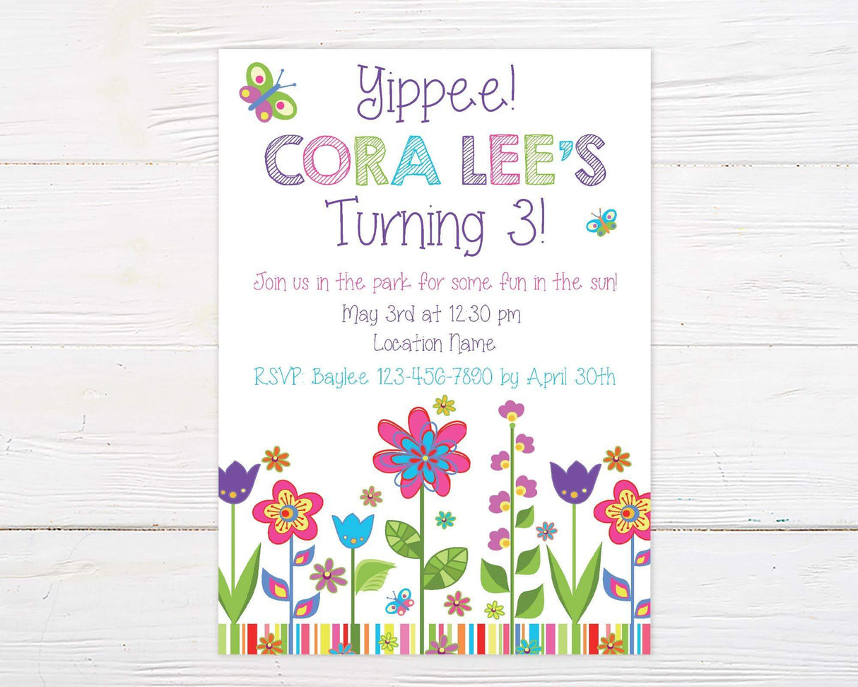 Colorful birthday invitation with playful fonts, bright flowers, butterflies, and striped accents, celebrating a third birthday with a fun outdoor theme.