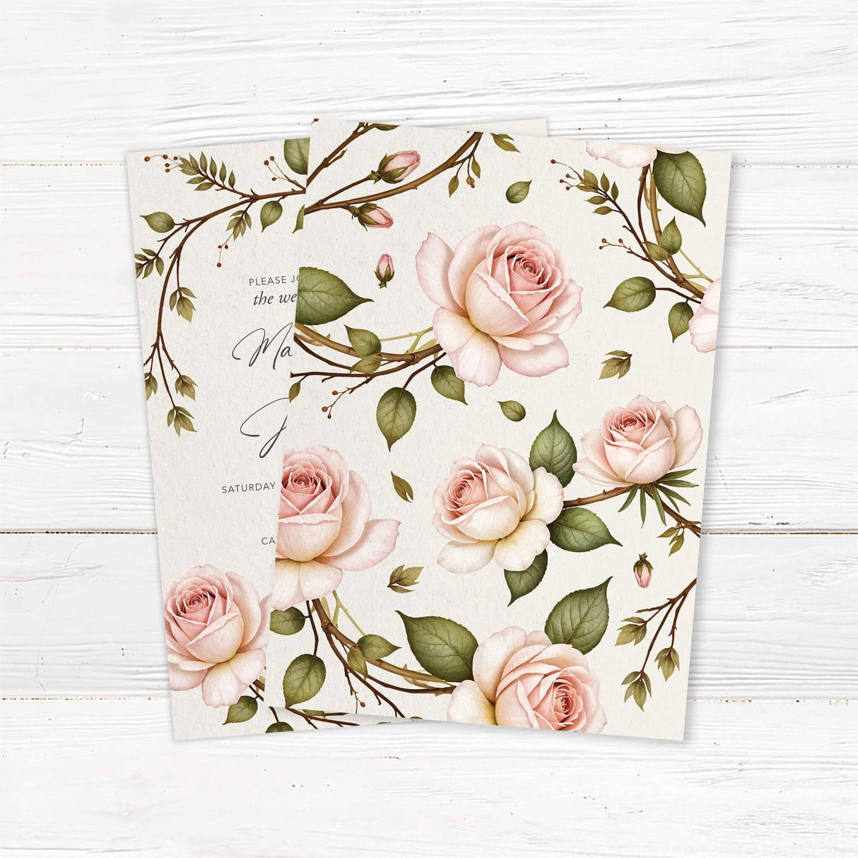 Elegant wedding invitation featuring a romantic watercolor floral design with soft blush pink roses and lush green leaves. A delicate arched floral frame surrounds the modern typography, perfect for classic, vintage, and garden weddings. Back.