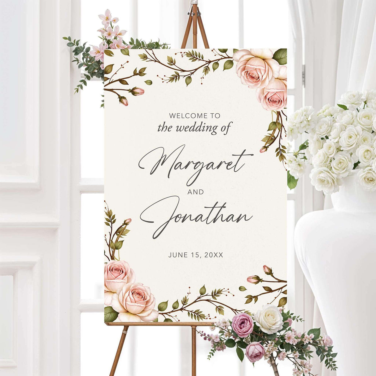 Elegant welcome sign featuring a romantic watercolor blush pink rose and greenery design. The warm and inviting floral accents create a stylish and memorable entrance for guests at the ceremony or reception.