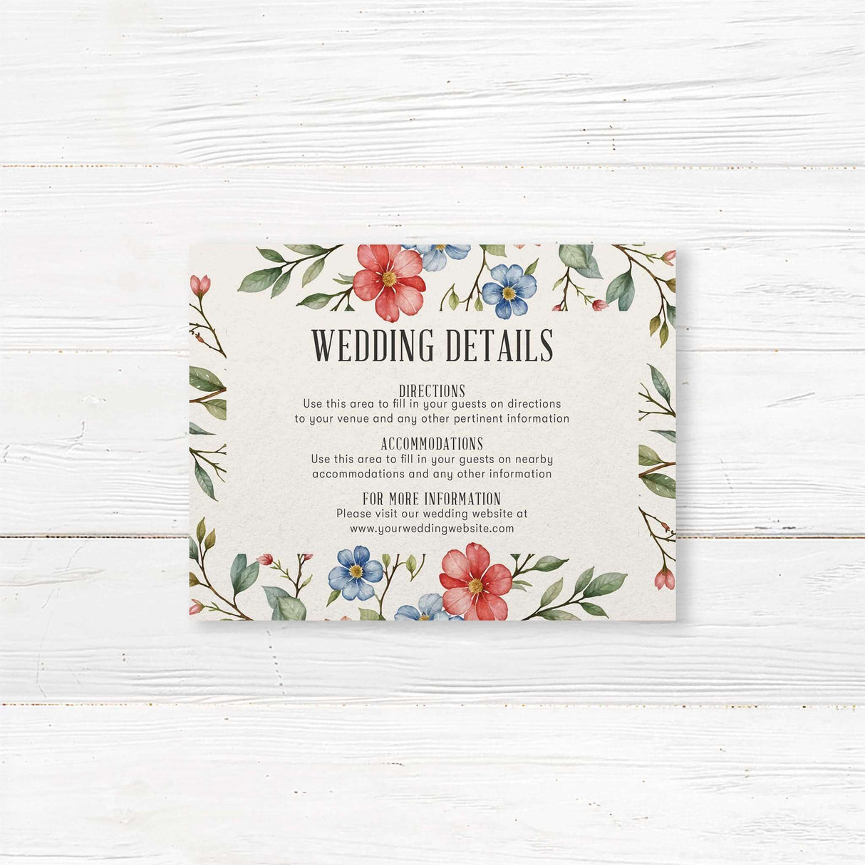 Elegant wedding detail card featuring a delicate watercolor floral design with red, blue, and pink flowers intertwined with green leaves. The layout is balanced with soft botanical elements framing the text, creating a romantic and timeless aesthetic