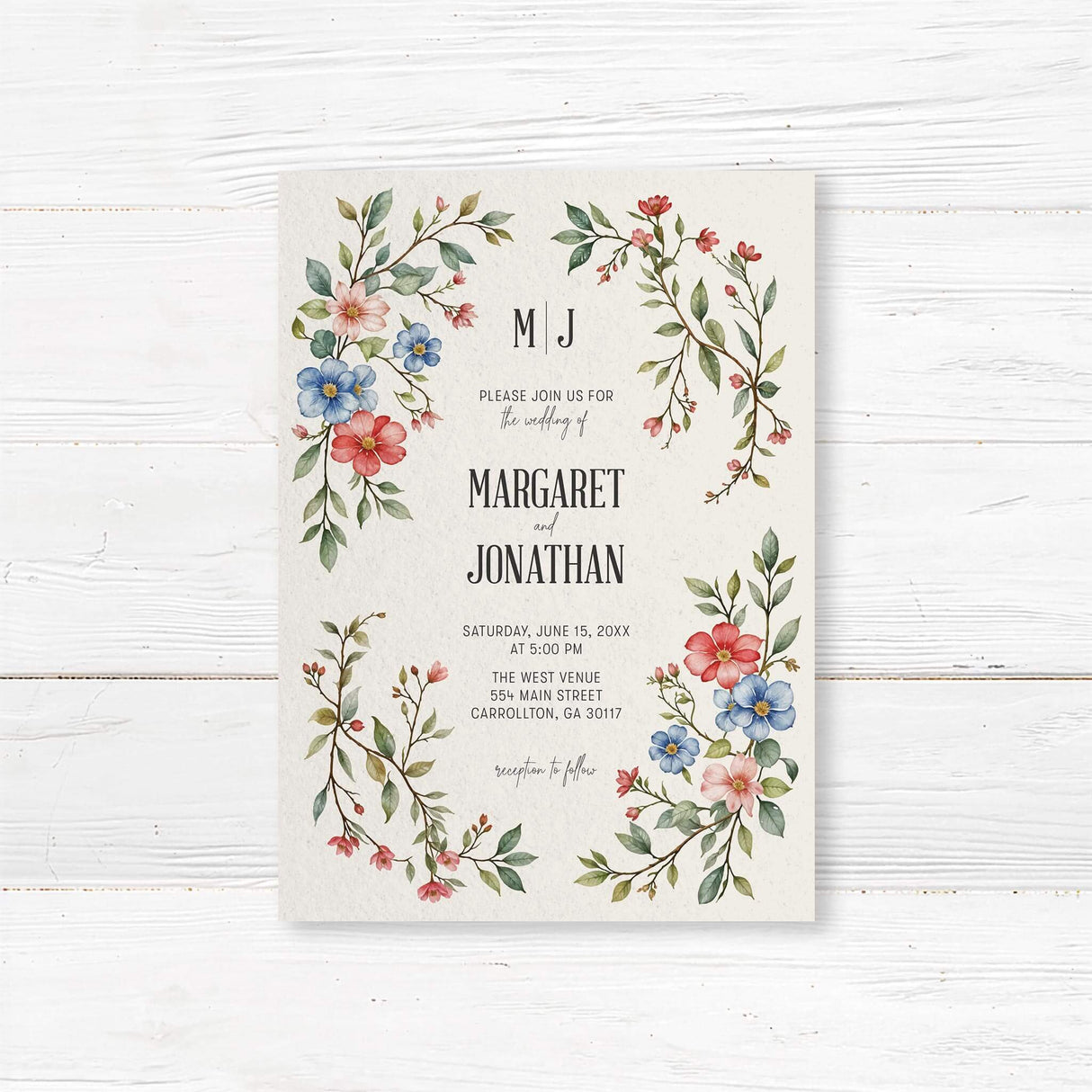 Elegant wedding invitation featuring a delicate watercolor floral design with red, blue, and pink flowers intertwined with green leaves. The layout is balanced with soft botanical elements framing the text, creating a romantic and timeless aesthetic