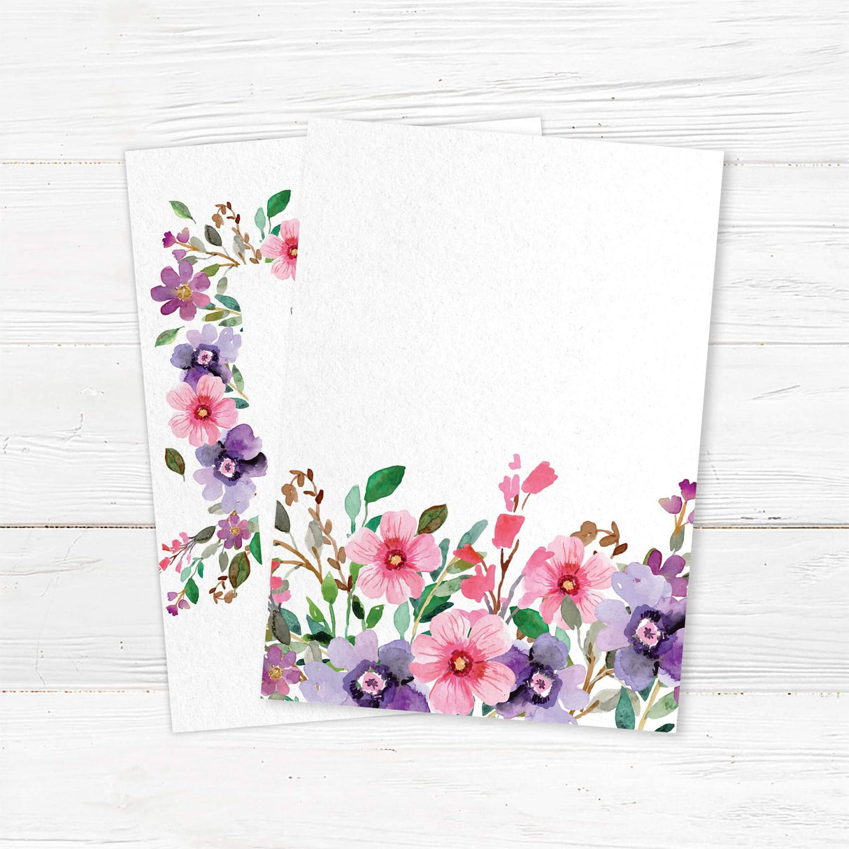 Elegant watercolor floral wedding invitation featuring pink and purple flowers with soft greenery. Printed on premium textured cardstock, perfect for romantic, botanical, and garden-themed weddings. Customizable with names, wedding date, and venue details. back