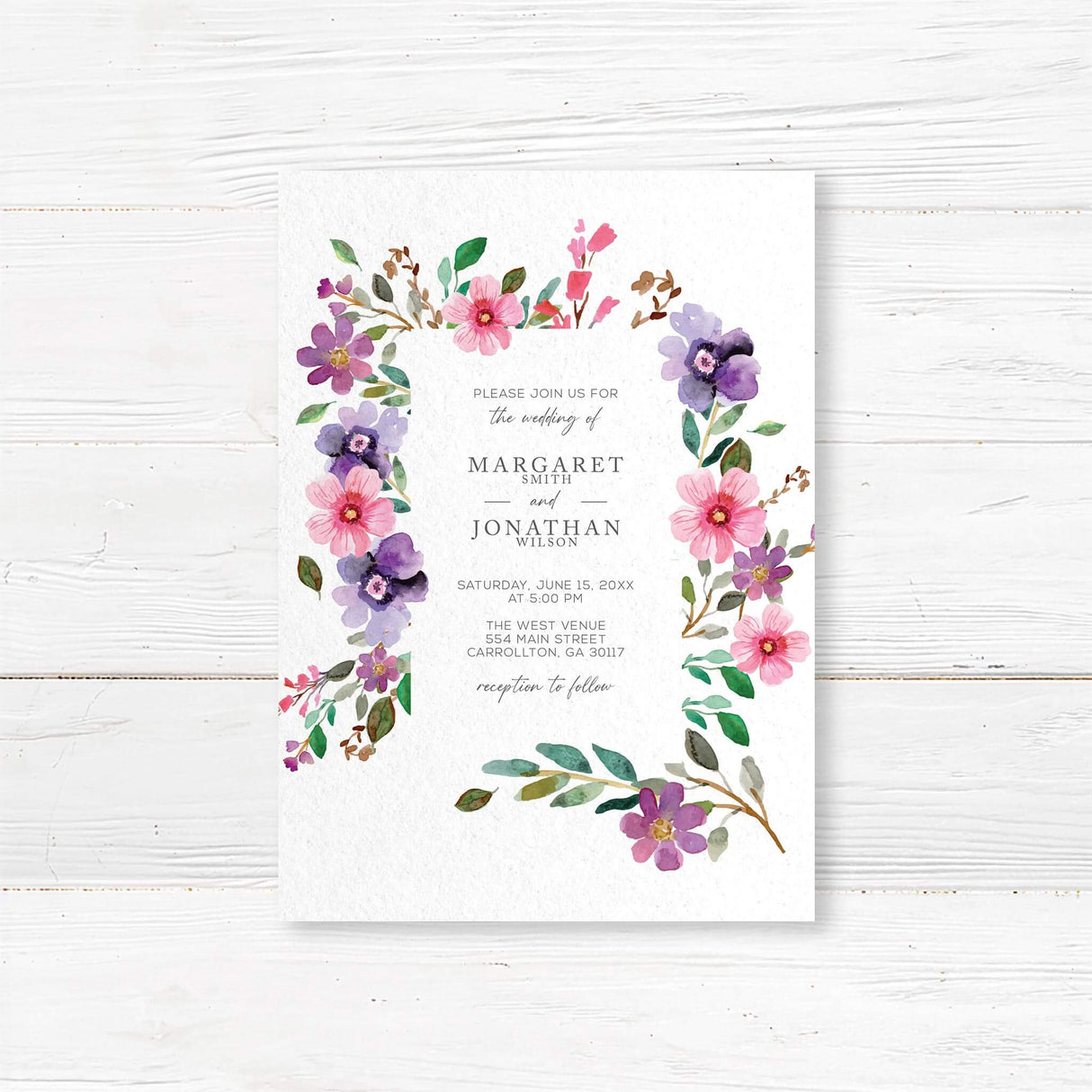Elegant watercolor floral wedding invitation featuring pink and purple flowers with soft greenery. Printed on premium textured cardstock, perfect for romantic, botanical, and garden-themed weddings. Customizable with names, wedding date, and venue details."