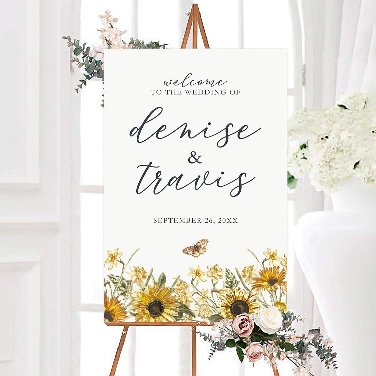 Personalized sunflower and butterfly wedding welcome sign featuring golden sunflowers, wildflowers, green leaves, and a butterfly along the bottom. Elegant black script displays the couple’s names with their wedding date below.