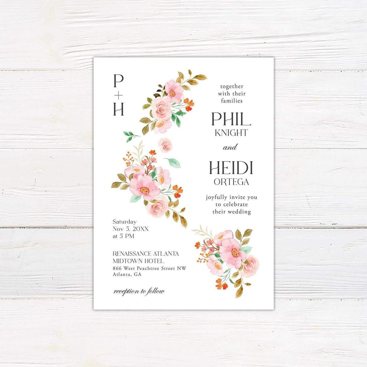 Wedding invitation with sweeping watercolor floral vine in pink, coral, and green tones on a white background with serif and script typography.