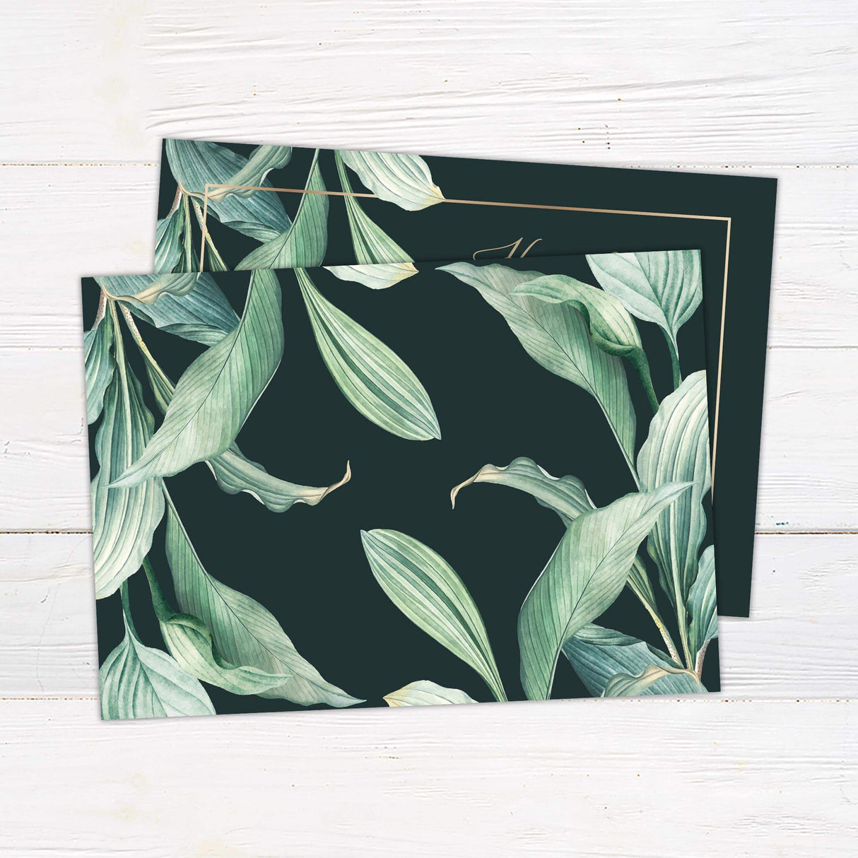 Elegant dark green wedding invitation with sweeping watercolor greenery and gold script text, designed for formal botanical or winter weddings. - back side