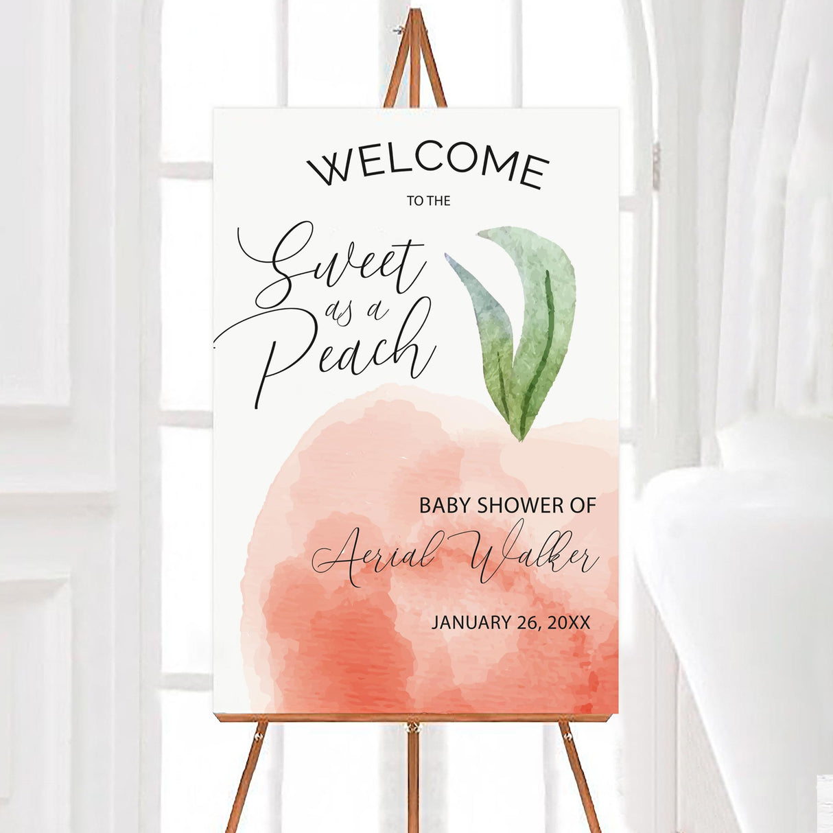 A sweet as a peach baby shower welcome sign featuring a watercolor peach and green leaves. The design uses soft pastel colors and elegant script text.