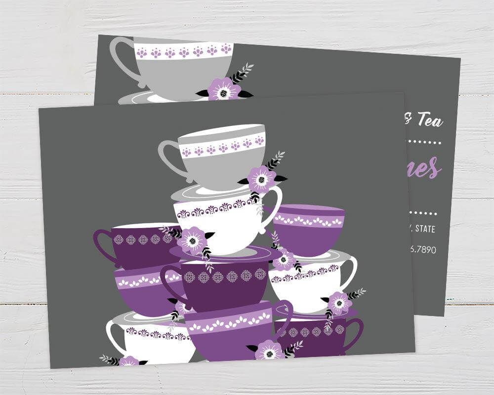 A tea cup-themed bridal shower invitation with stacked purple teacups and floral accents. The design features script text on a gray background. - back.