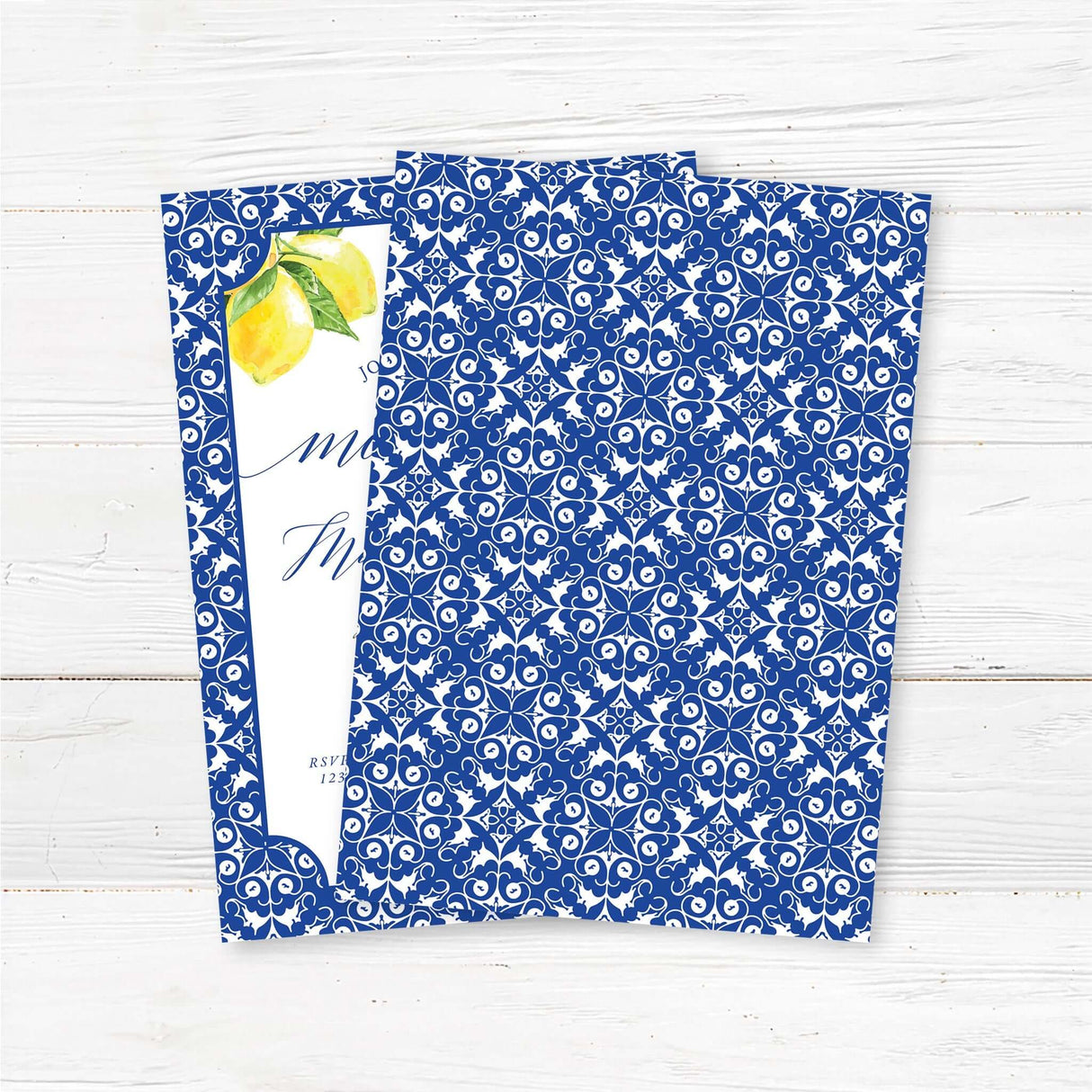 "Elegant blue and white tea party invitation featuring a classic ornate border, watercolor lemons, and a delicate floral teacup illustration. The design includes stylish script and serif fonts, creating a sophisticated and charming look. Perfect for tea party-themed celebrations with a timeless and elegant touch." back.